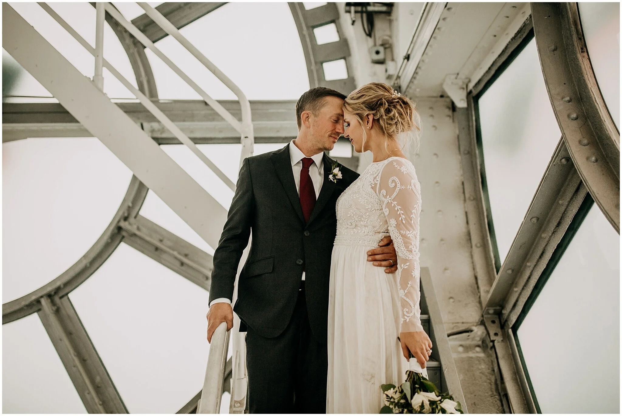 bride and groom portrait inside clock tower in vancouver block