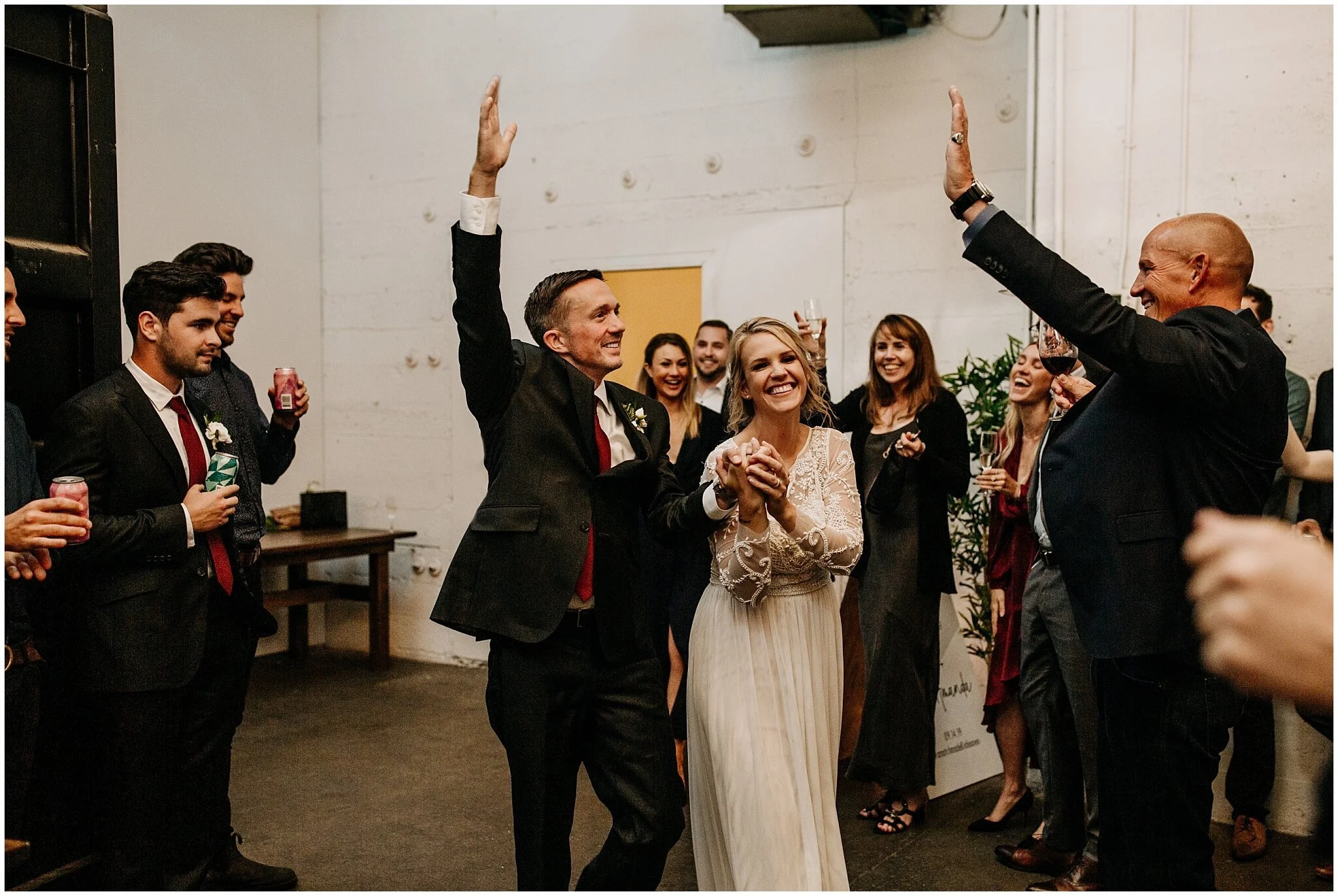 bride and groom reception entrance at settlement building wedding