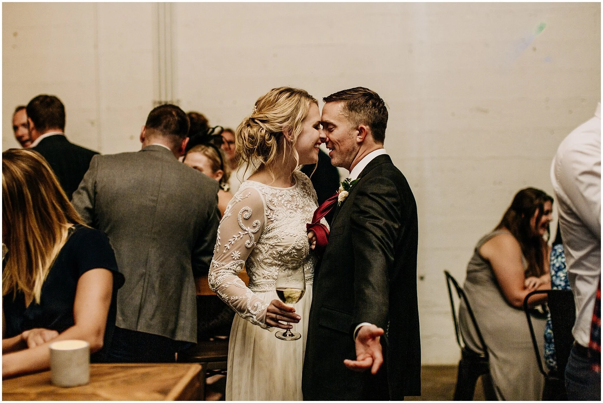 bride and groom cute candid moment at settlement building wedding