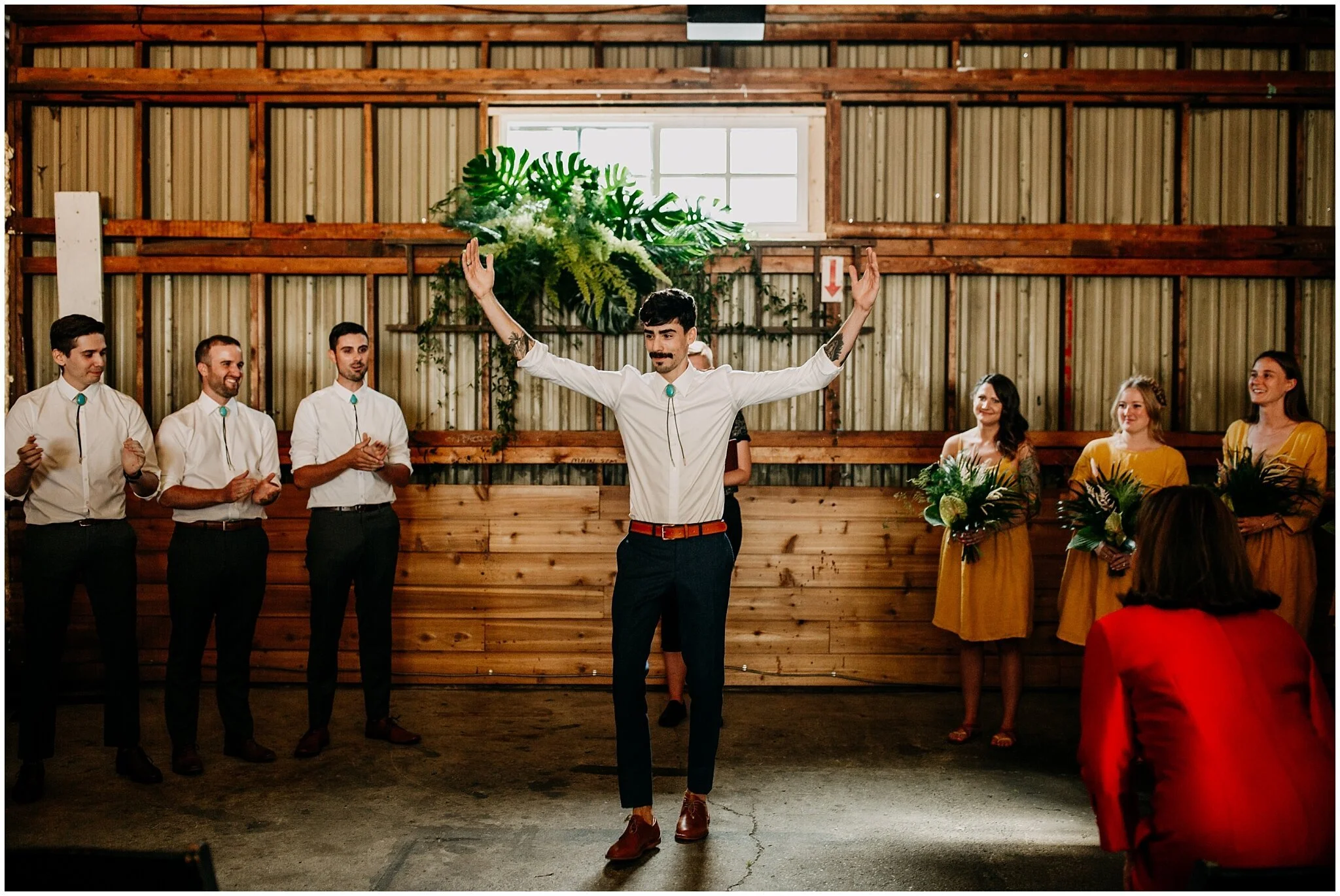 groom's entrance to ellis building wedding ceremony