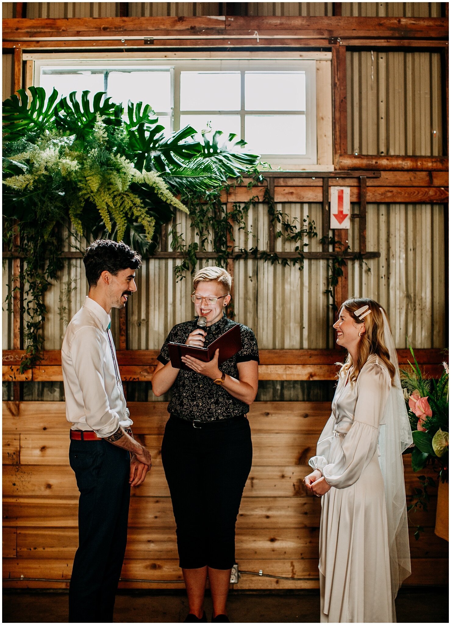 bride and groom laughing candid at ellis building wedding ceremony