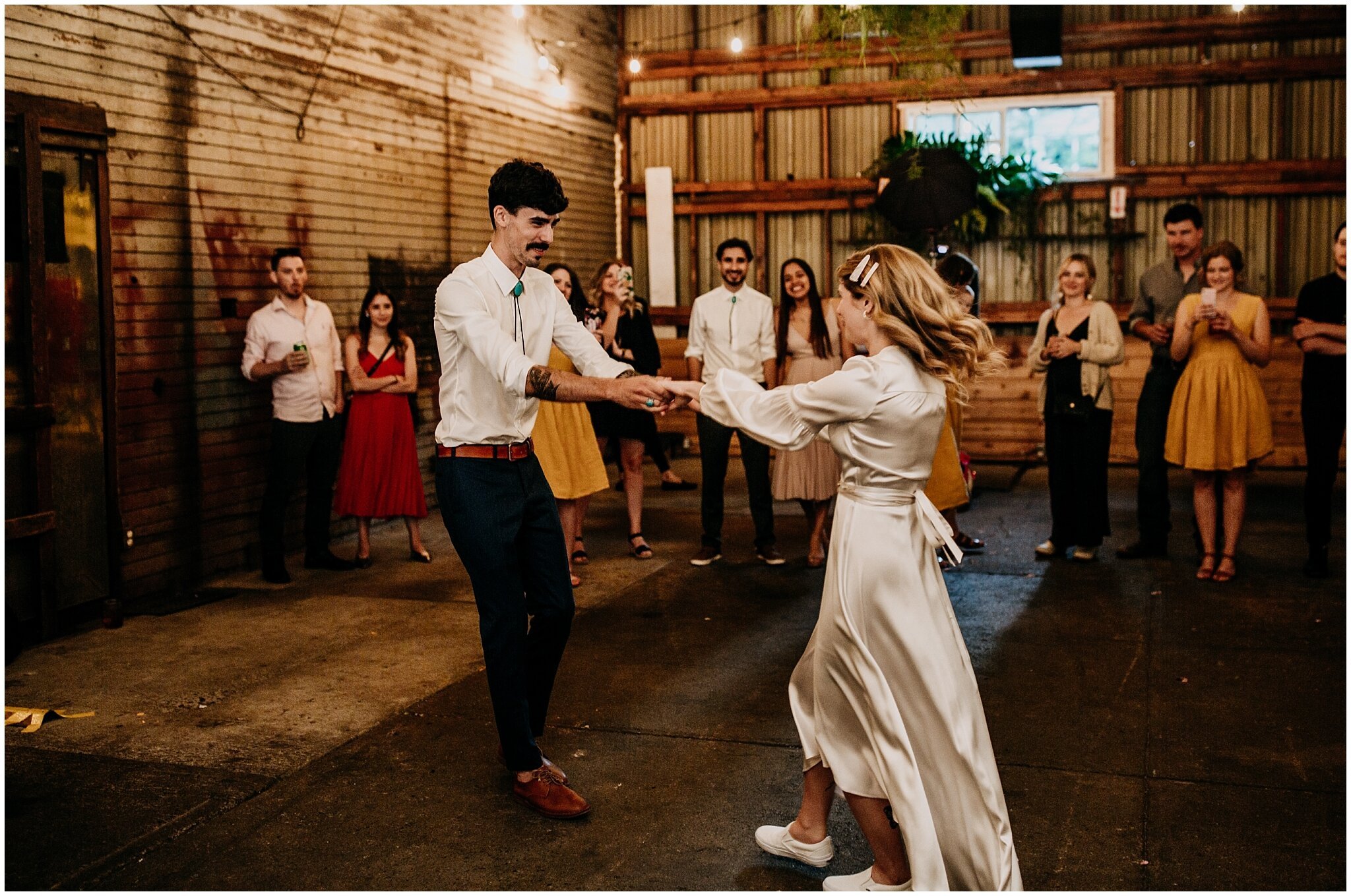 bride and groom playful first dance at ellis building wedding