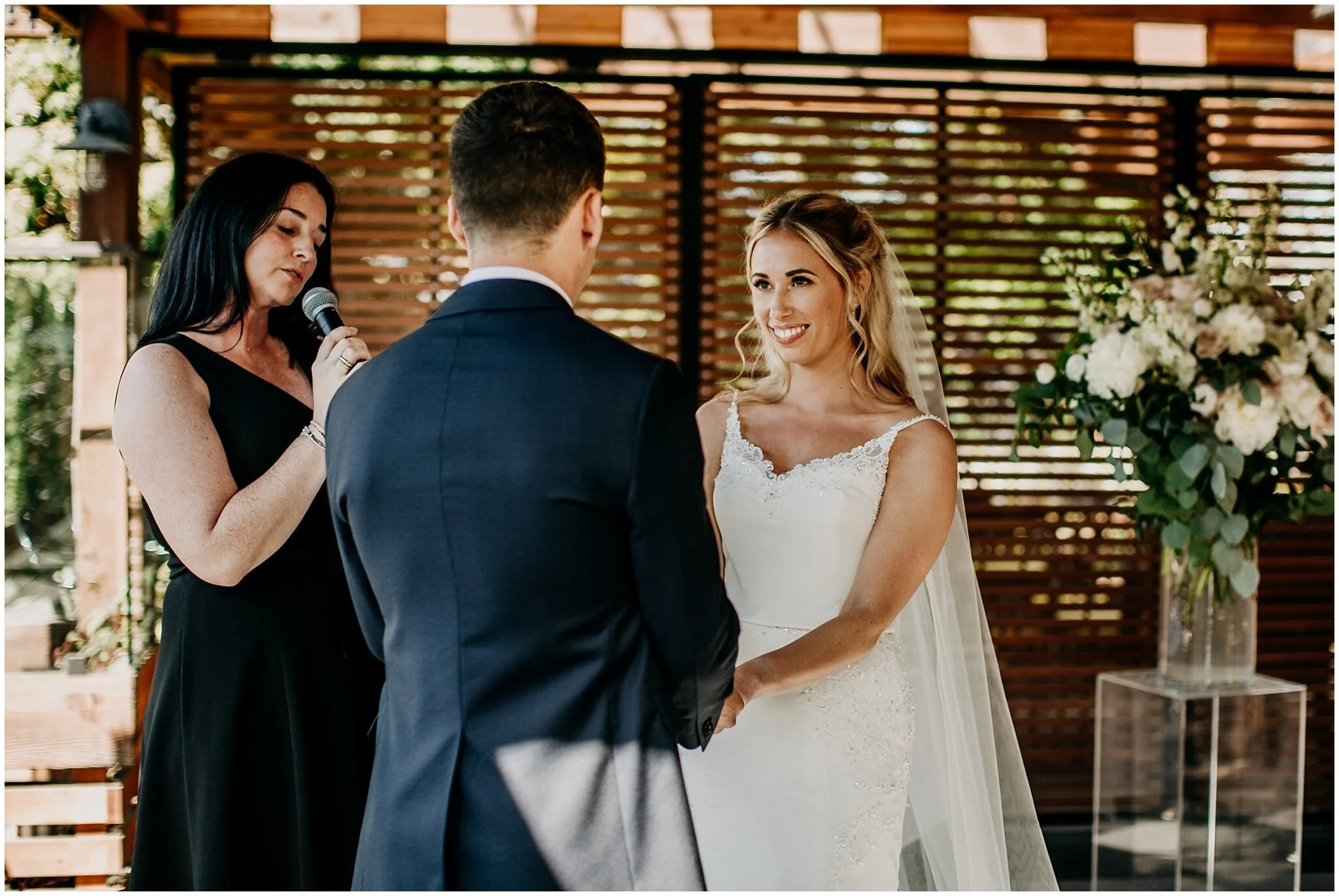bride looking at groom during ceremony at shaughnessy restaurant wedding