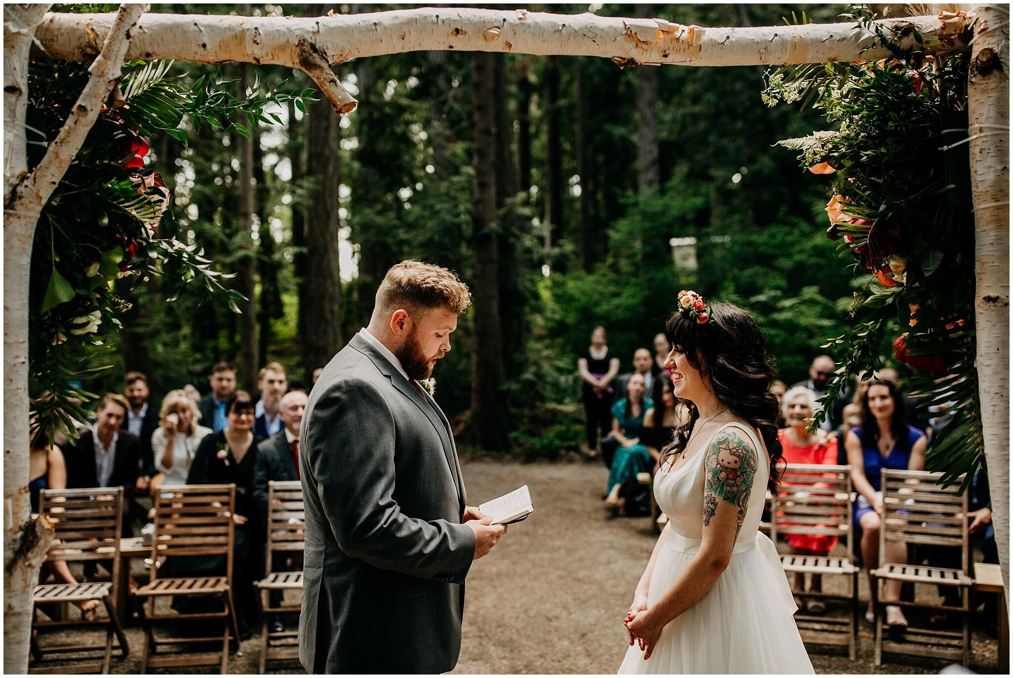 groom reading vows at ceremony at sea cider farm and ciderhouse wedding