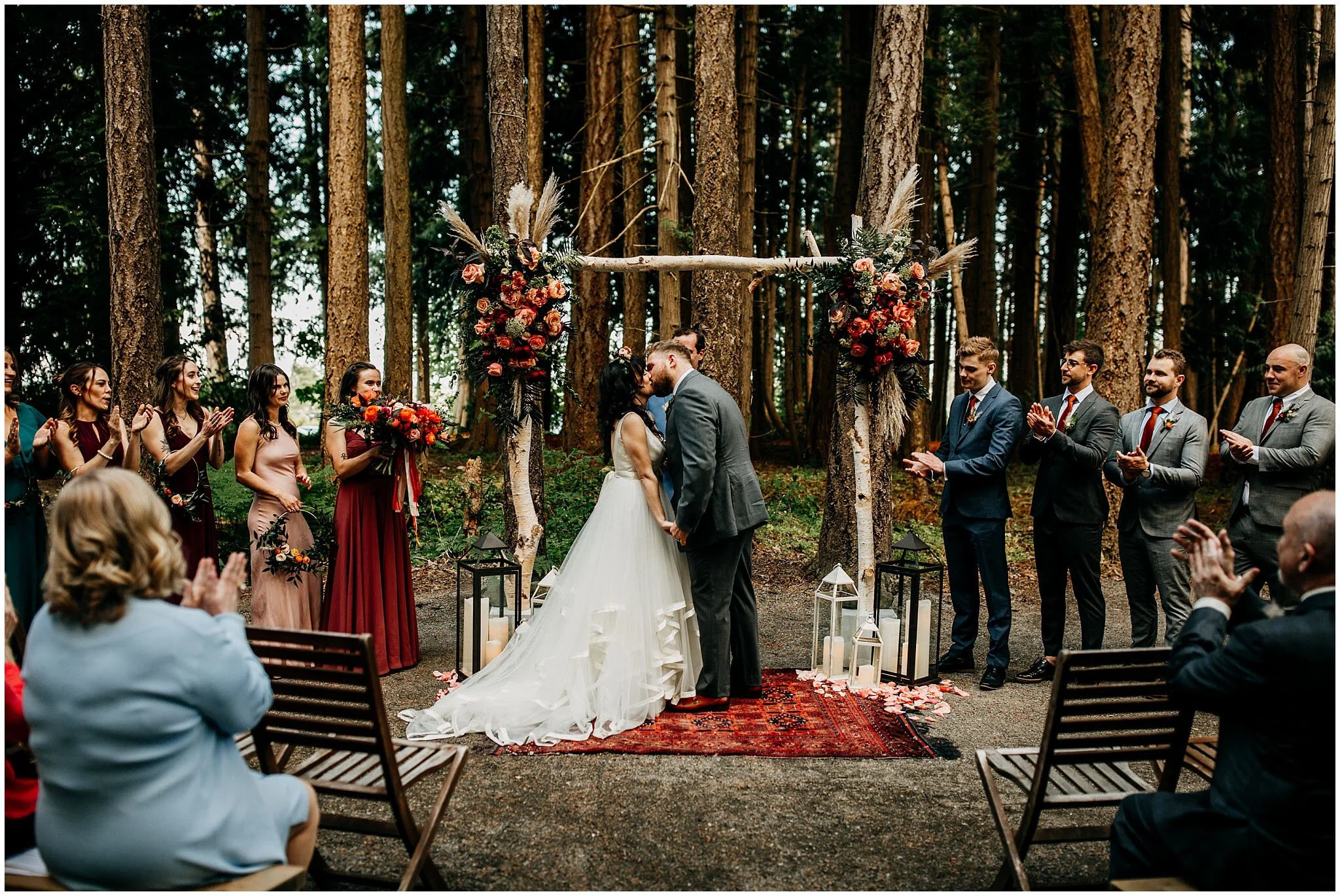 bride and groom first kiss at sea cider farm and ciderhouse wedding