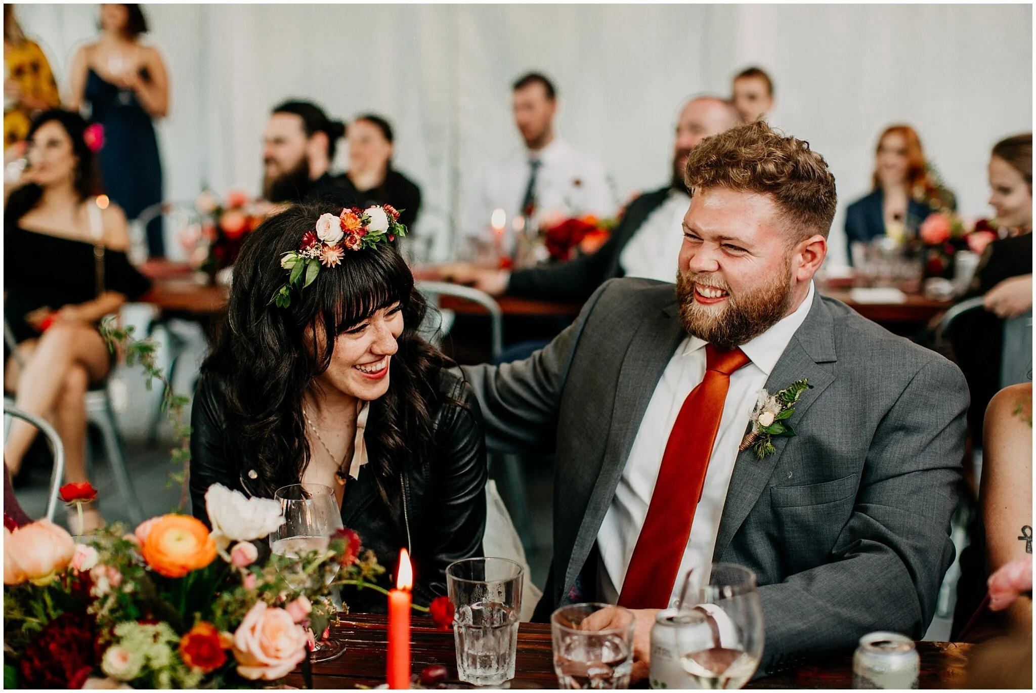 bride and groom laughing candid at sea cider farm and ciderhouse wedding