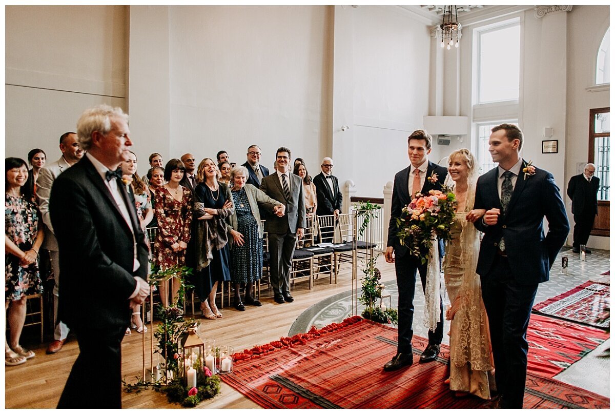 bride walking down the aisle during ceremony at the permanent