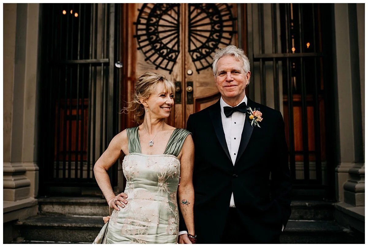 bride and groom portrait in front of doors at the permanent