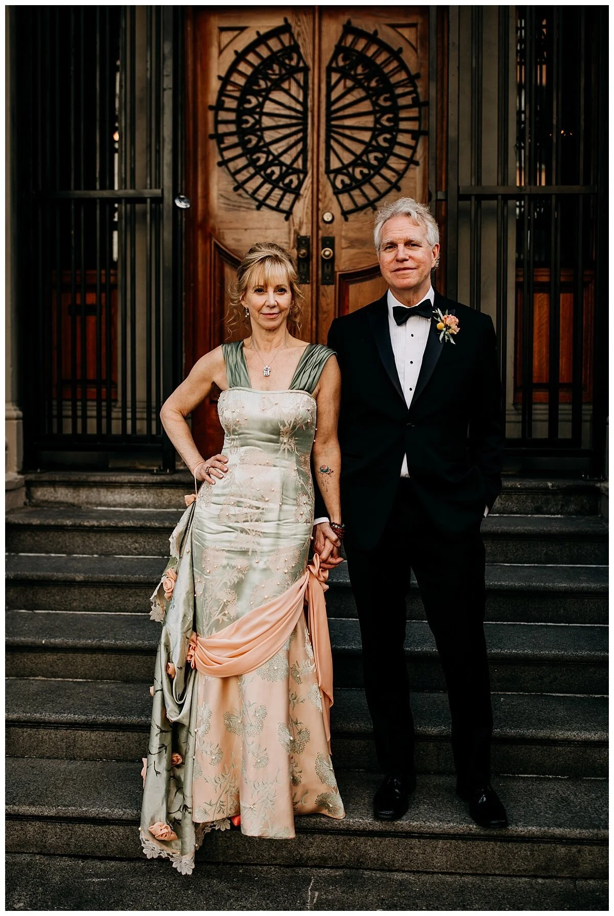 bride and groom portrait in front of doors at the permanent