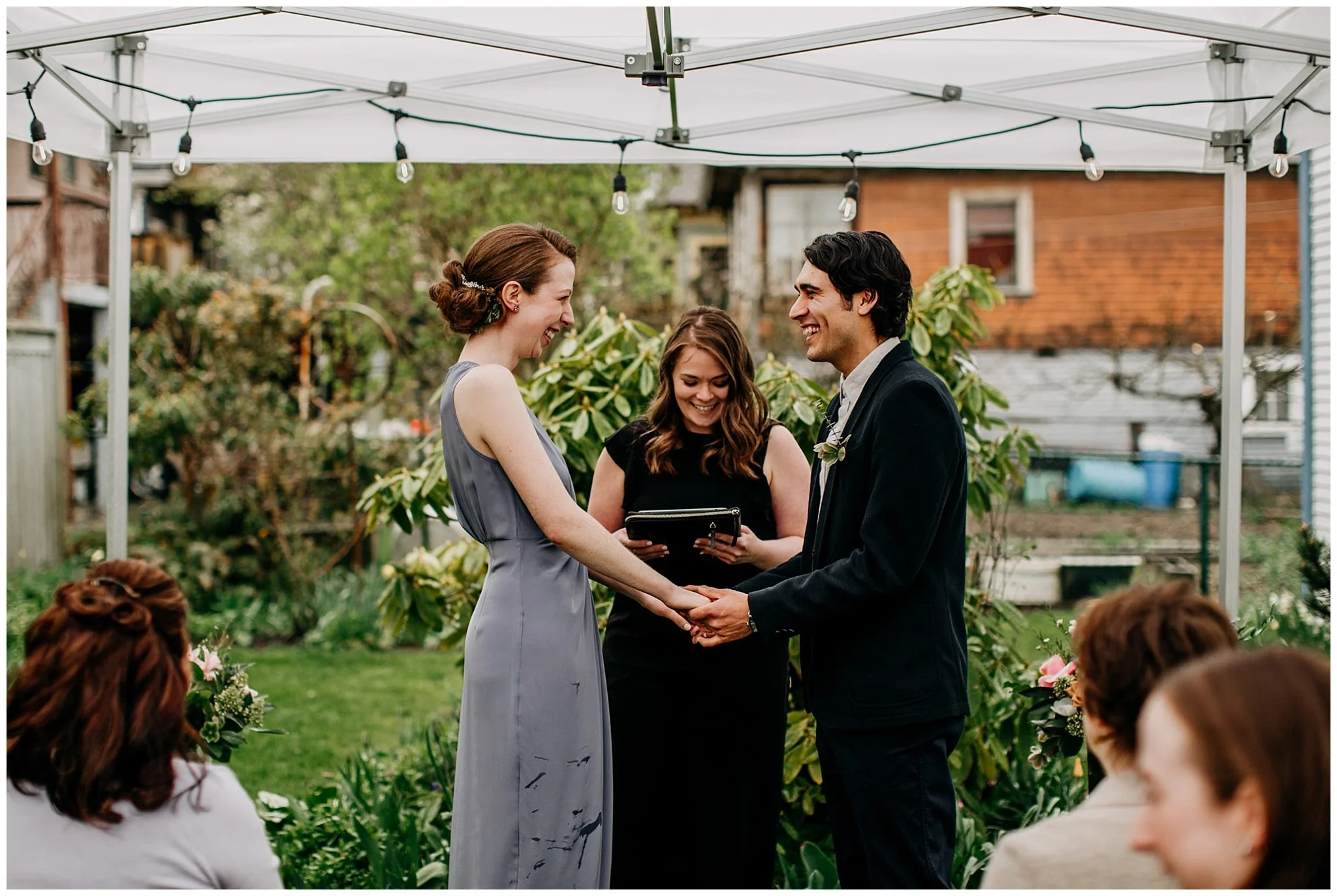 bride and groom at ceremony in vancouver backyard