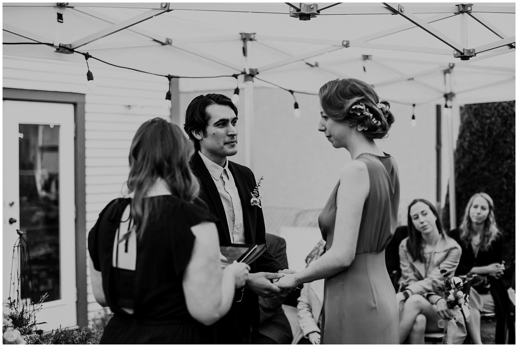 groom looking at bride during vancouver backyard ceremony