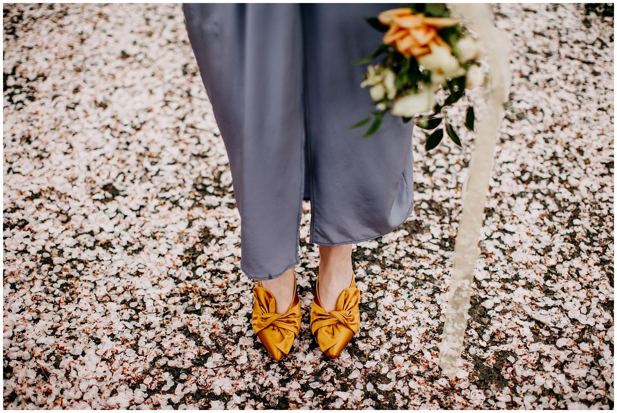 bride's vintage details under cherry blossom tree in vancouver