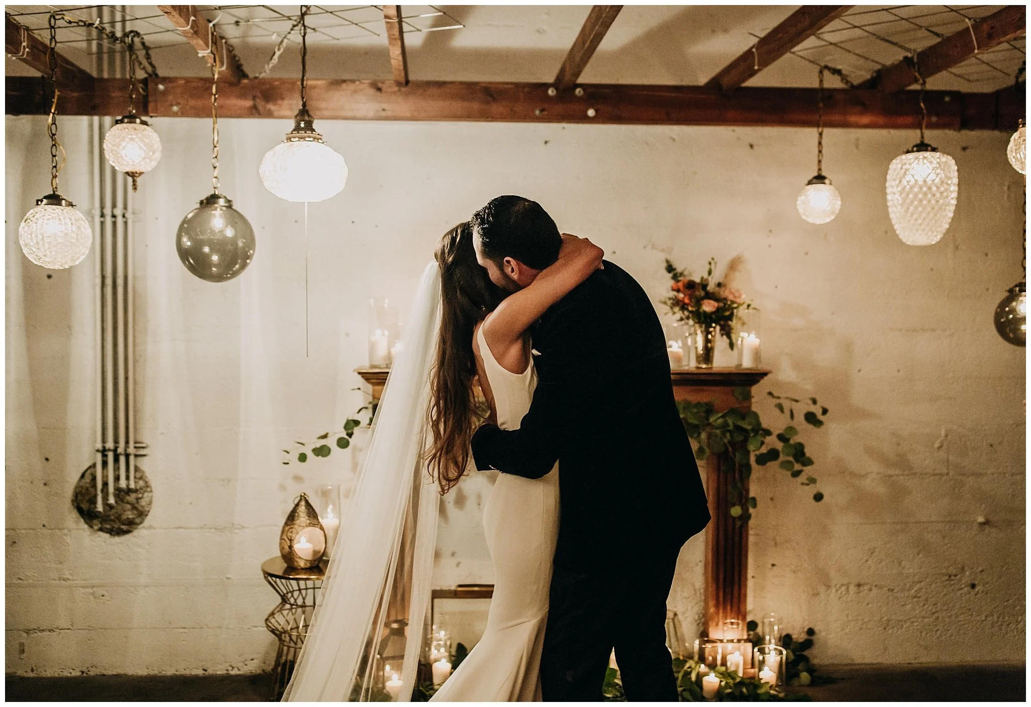 bride and groom hug at settlement building wedding ceremony