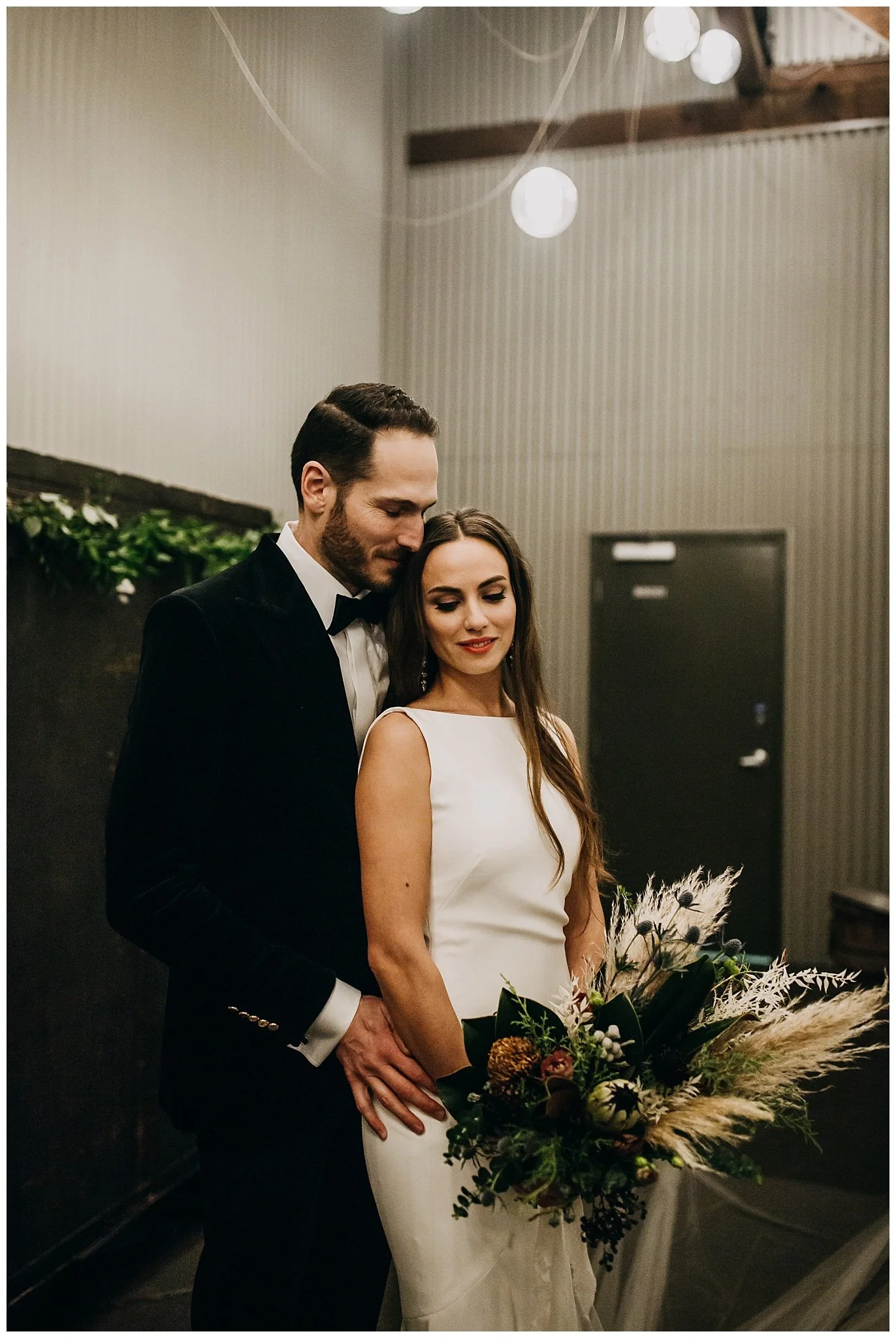 bride and groom wedding portrait inside settlement building