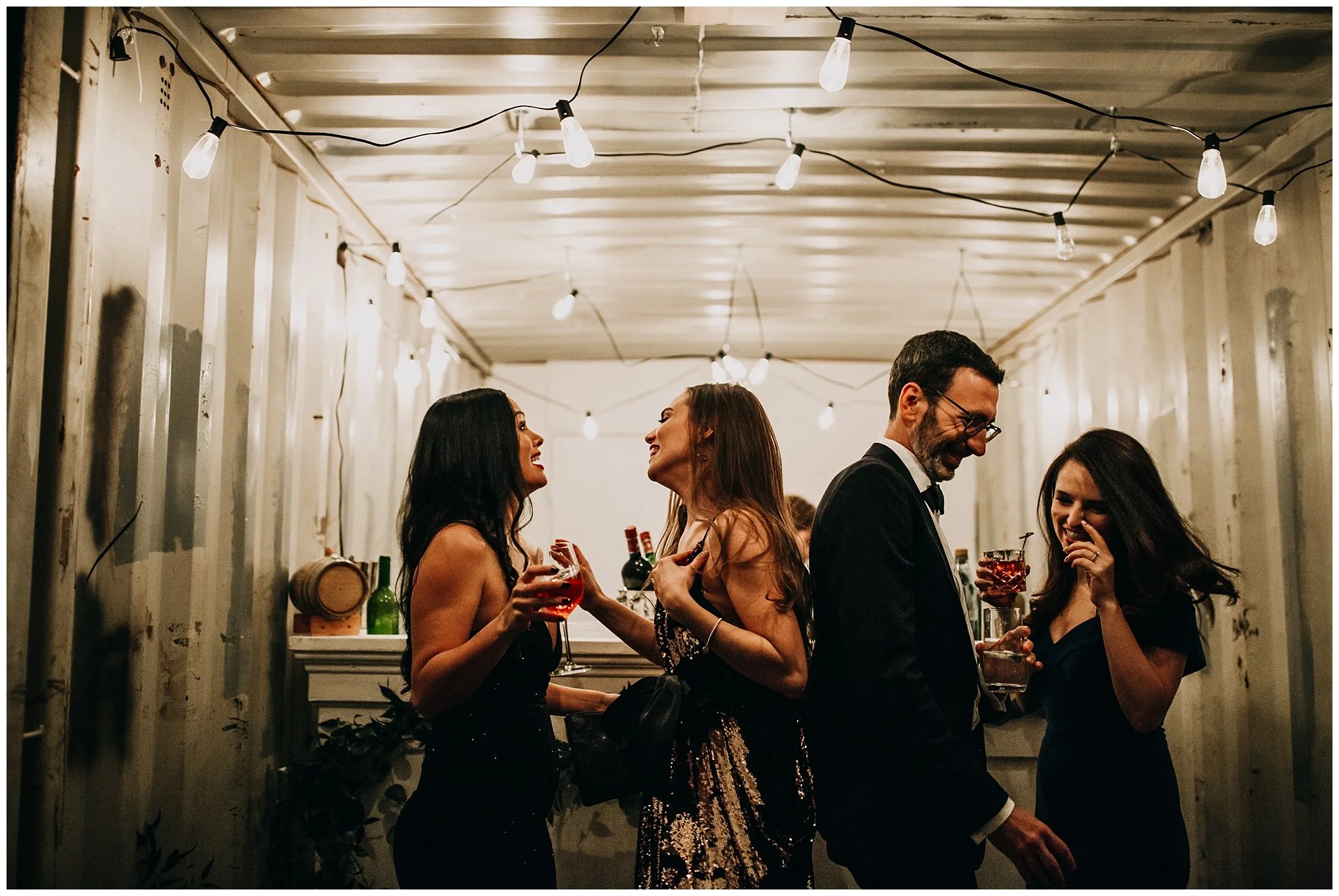 candid moment of bride at bar at settlement building wedding