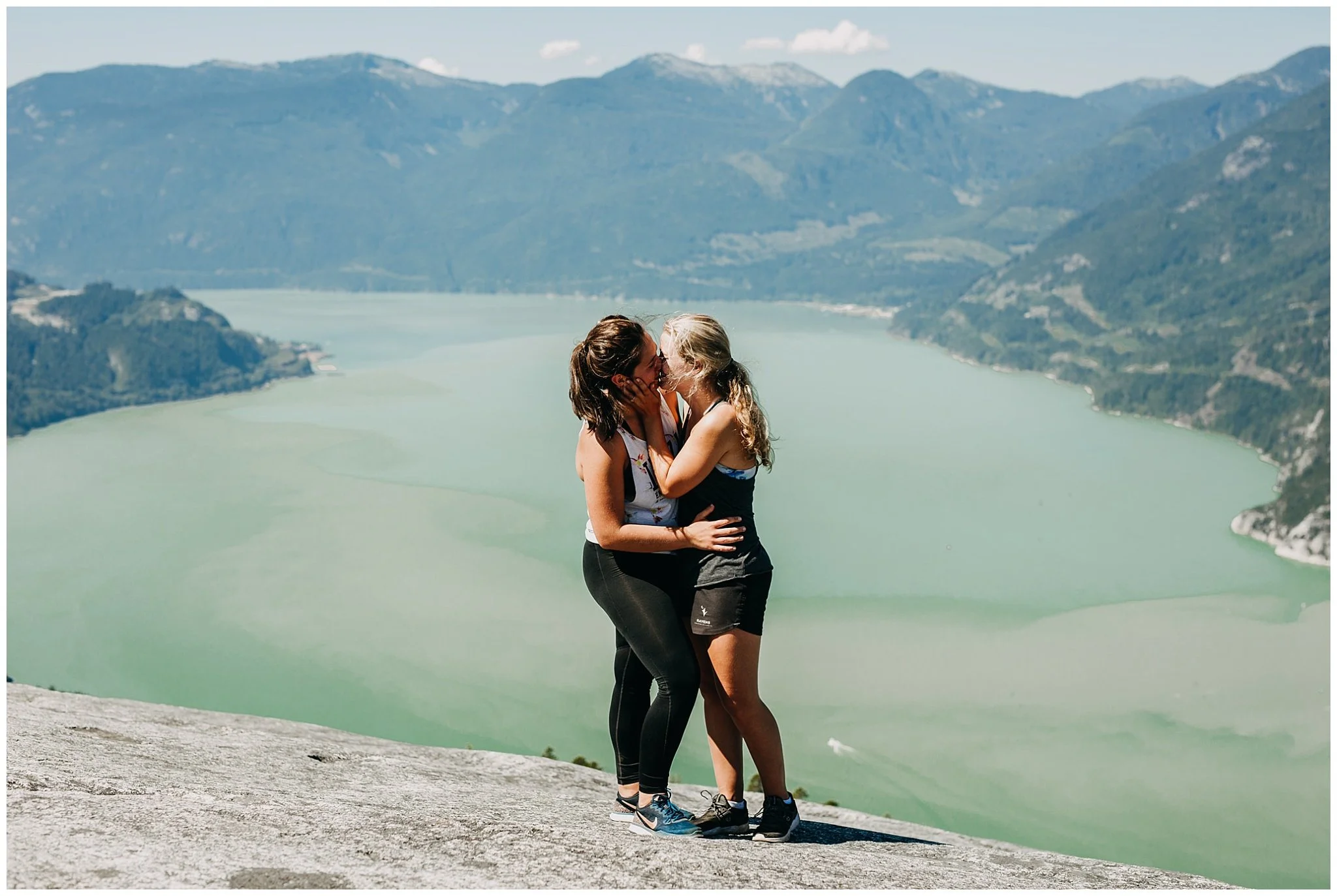 same sex couple portrait on the chief peak in squamish