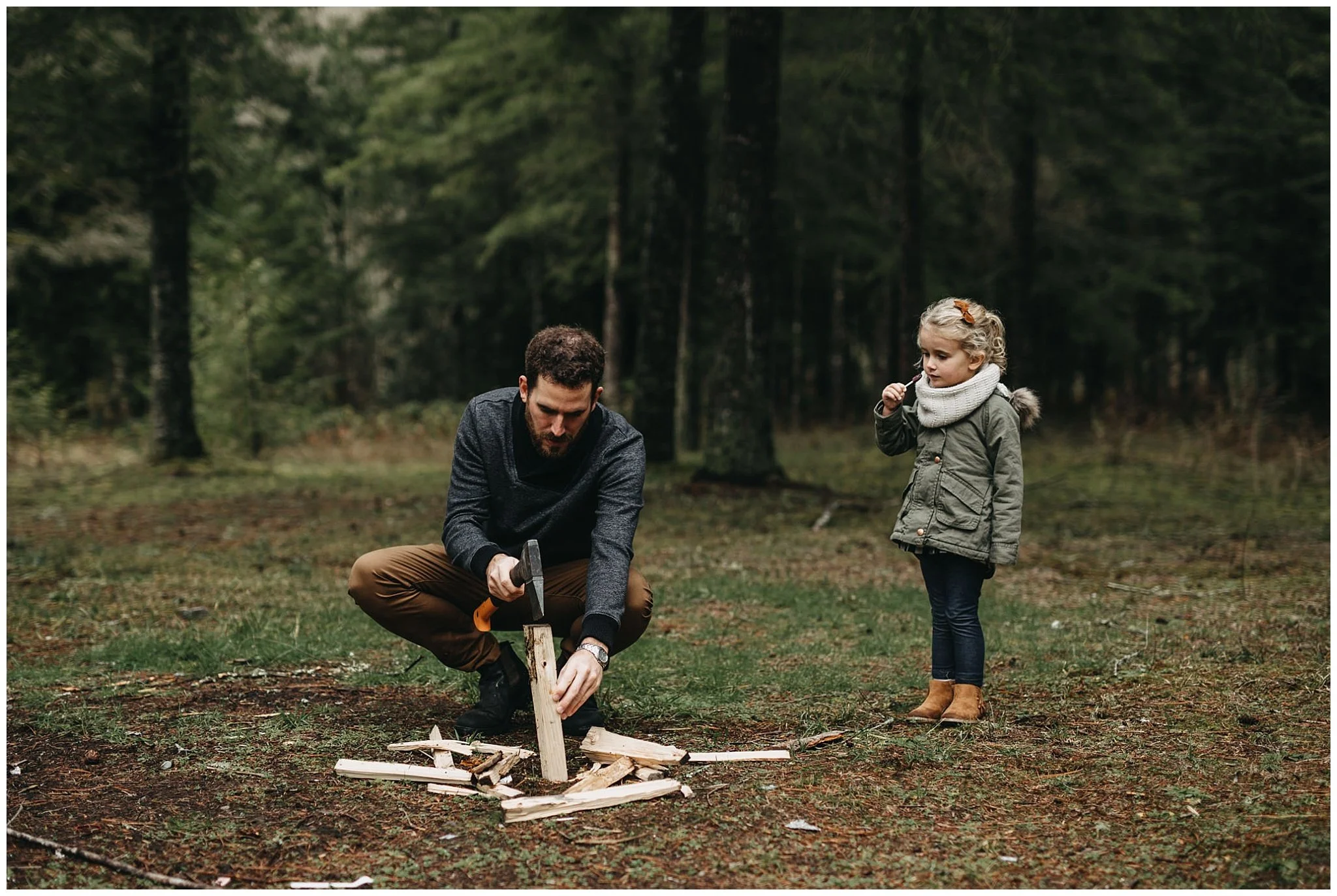 dad chopping firewood daughter watching family photos chilliwack