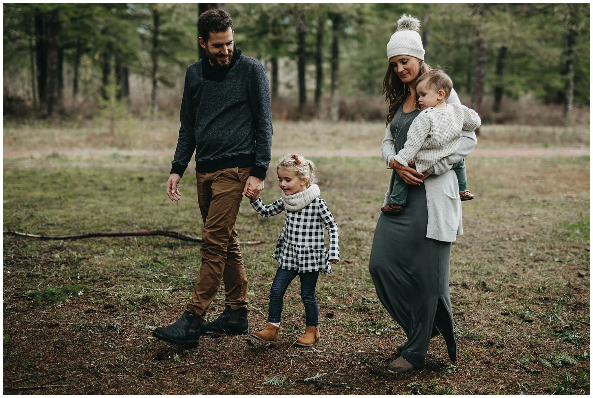 family holding hands walking through forest chilliwack 