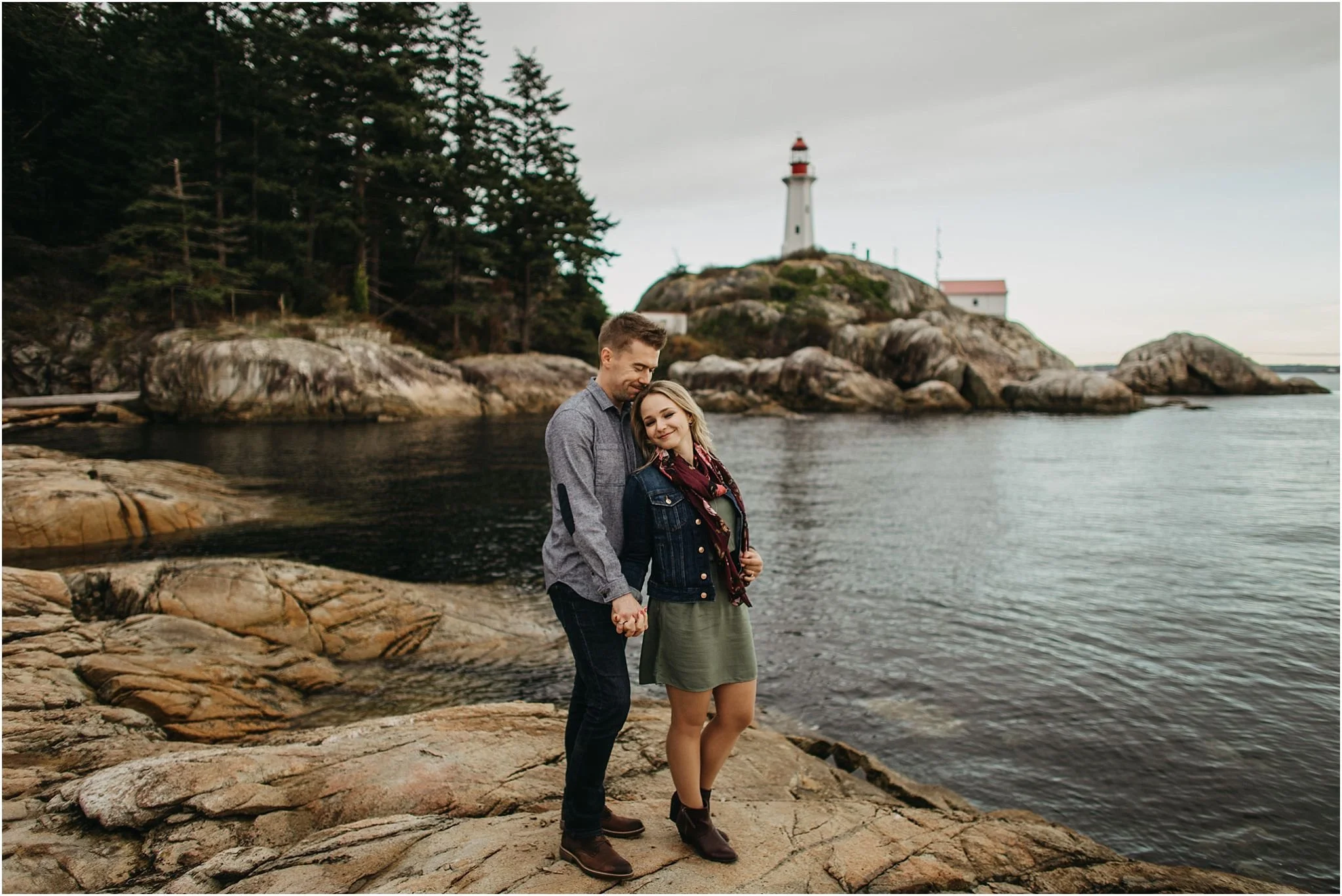 couple holding hands close together lighthouse park