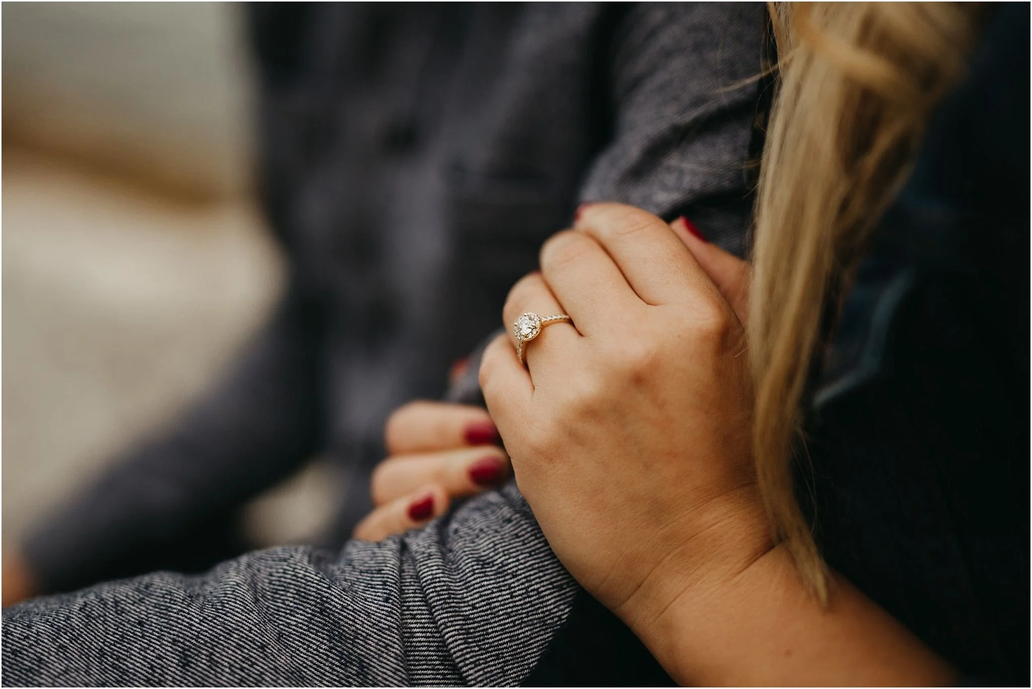 close up of engagement ring on hand