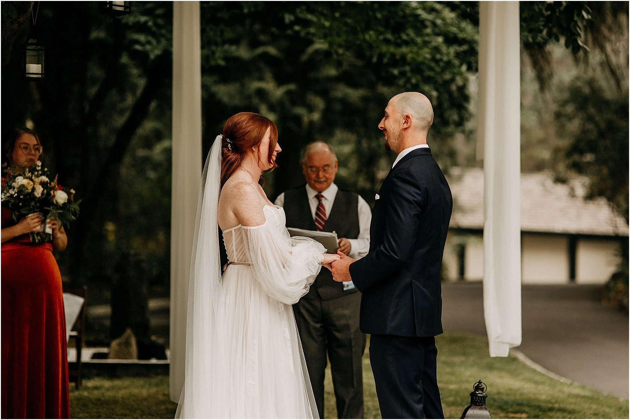 bride and groom hold hands in wedding ceremony Port Coquitlam BC