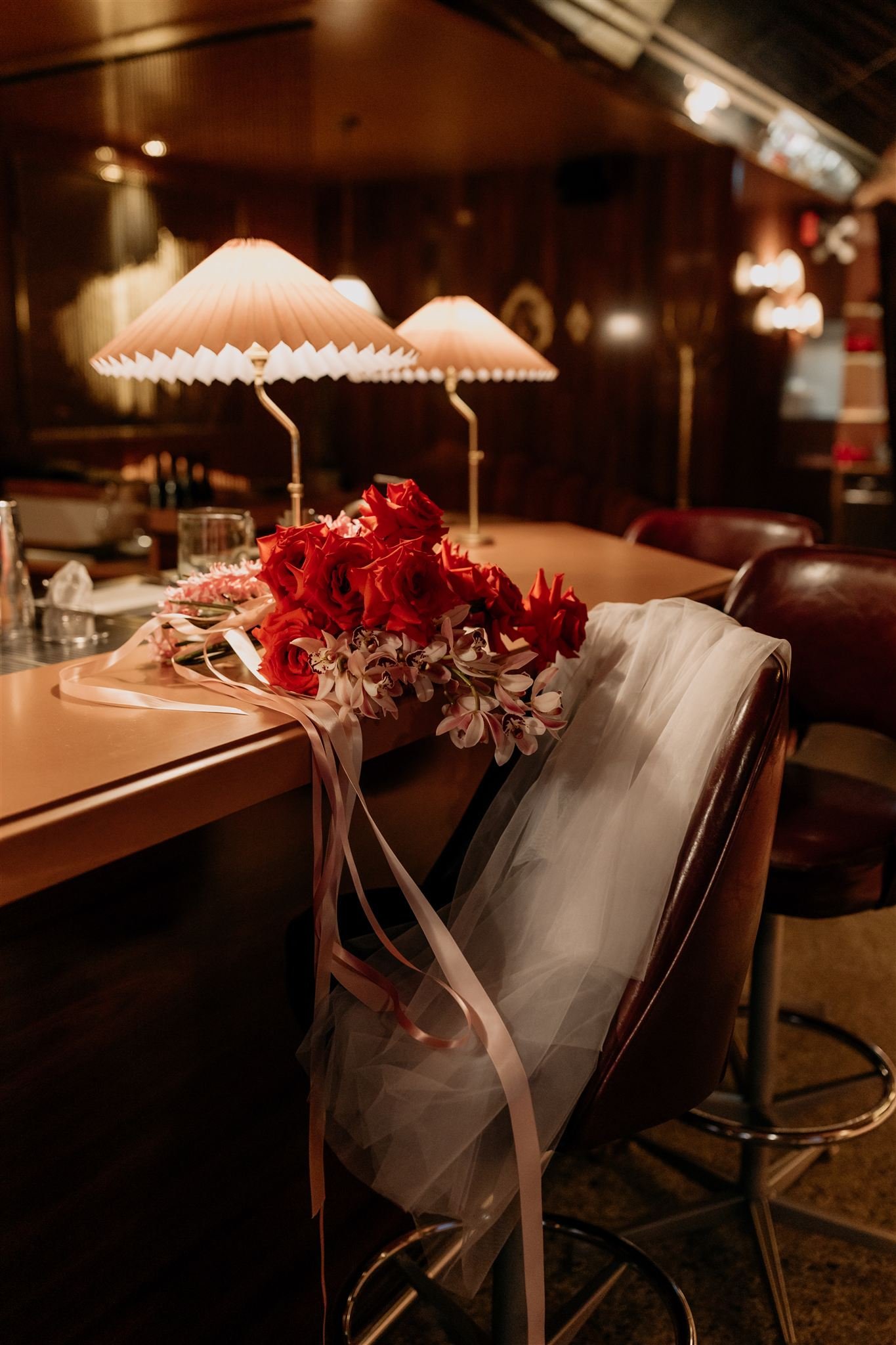 japanese jazz cafe inspired bar with bouquet and veil on chair