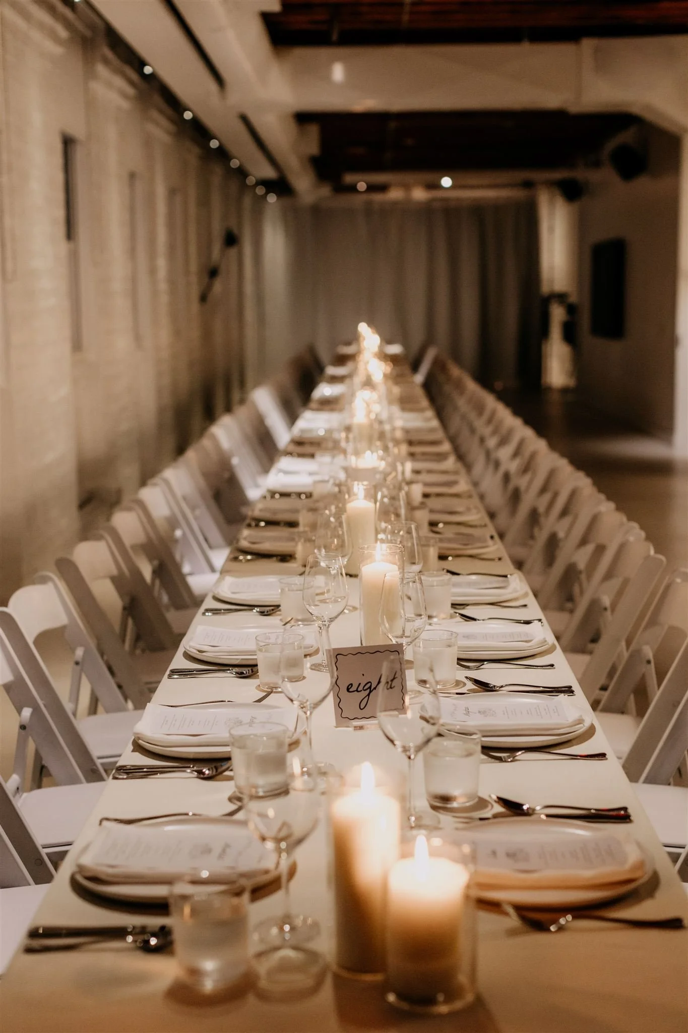 long table wedding reception decor with lots of candles inside The Kent