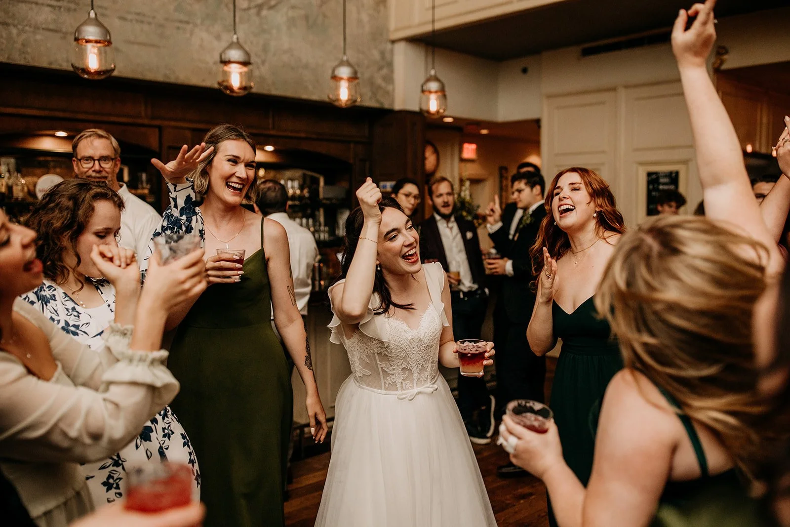 bride dancing with her friends during wedding at Cafe Medina