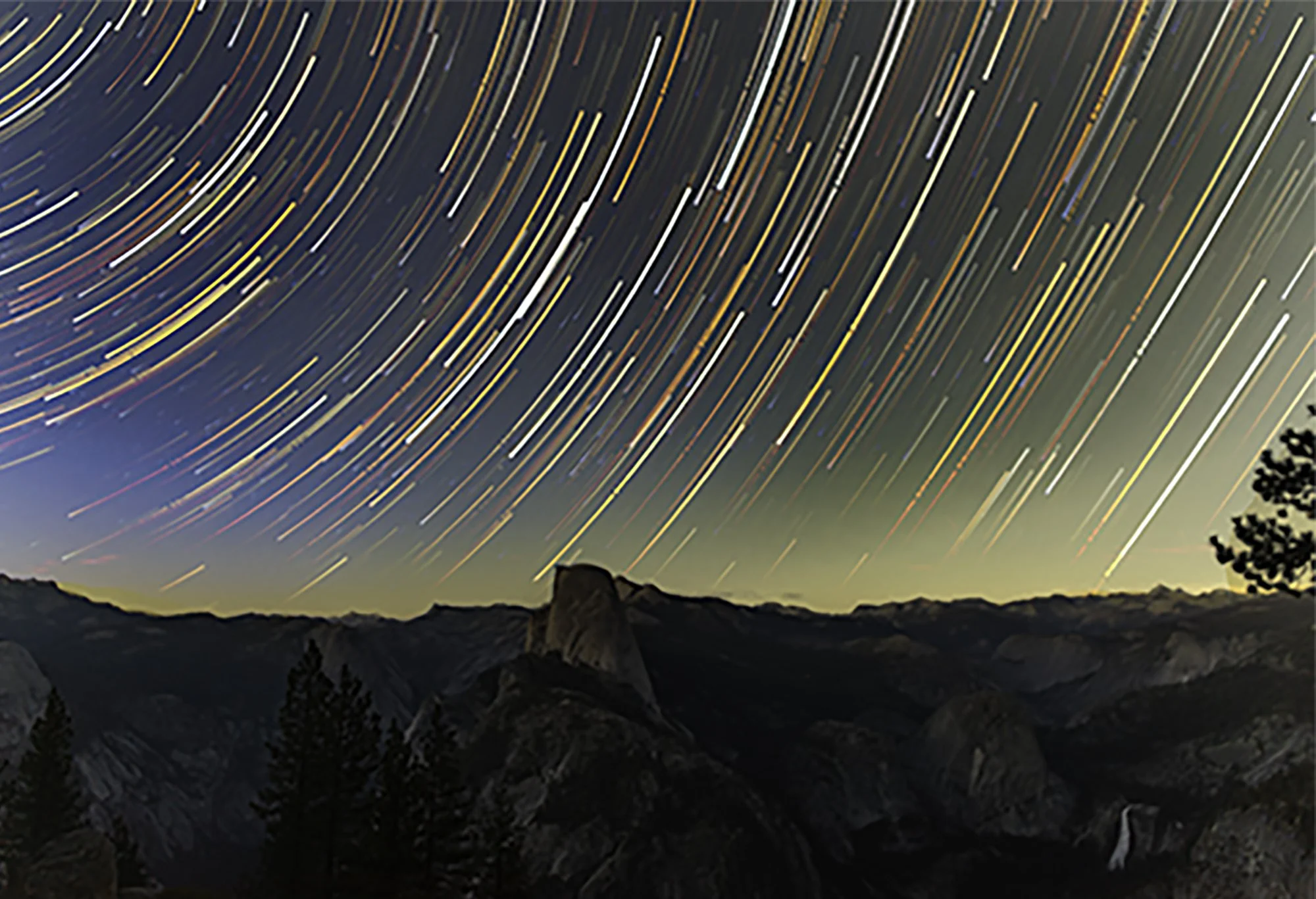 Star trail overlooking Yosemite National Park and Half Dome from Glacier Point