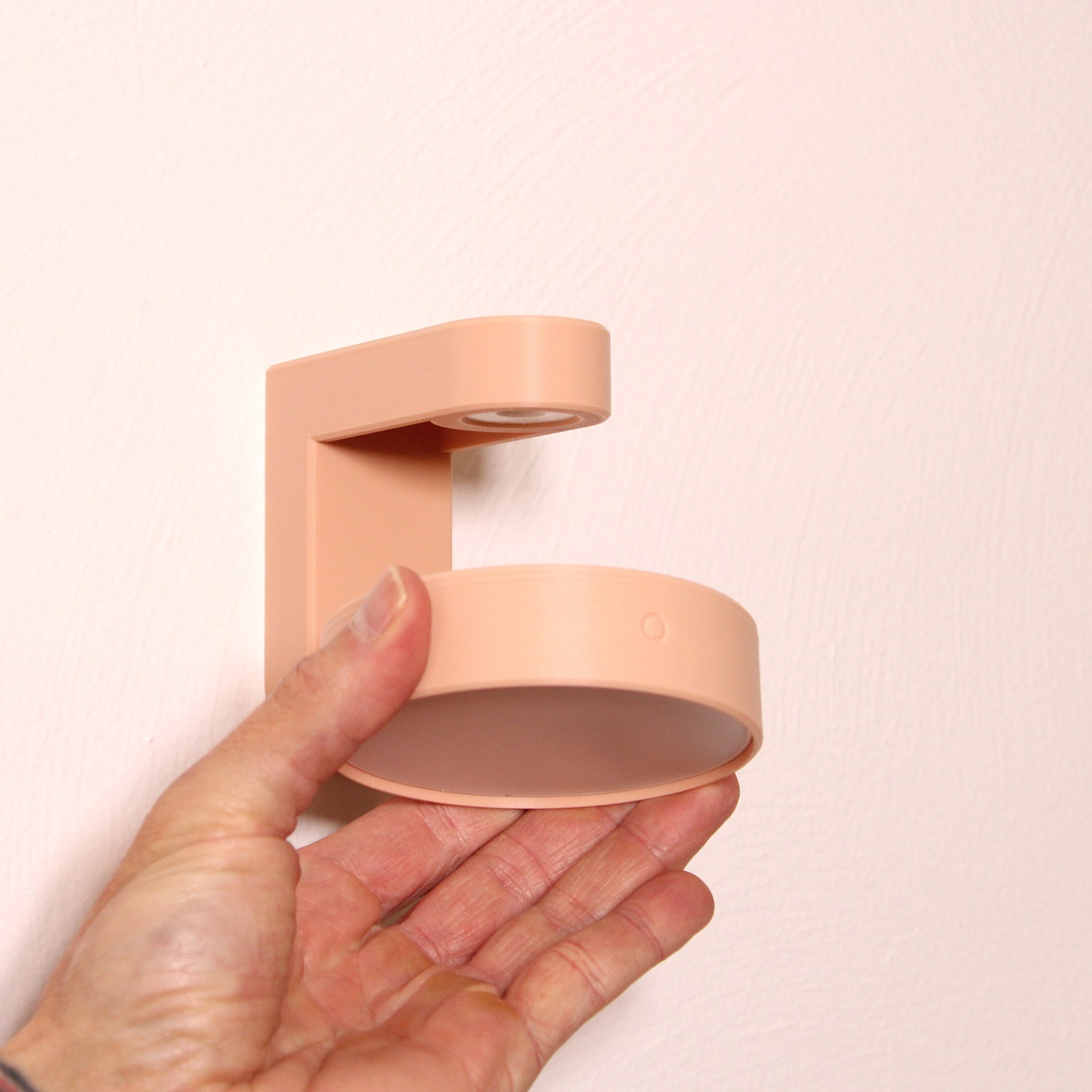 3D printed battery powered wall mounted LED lamp.
