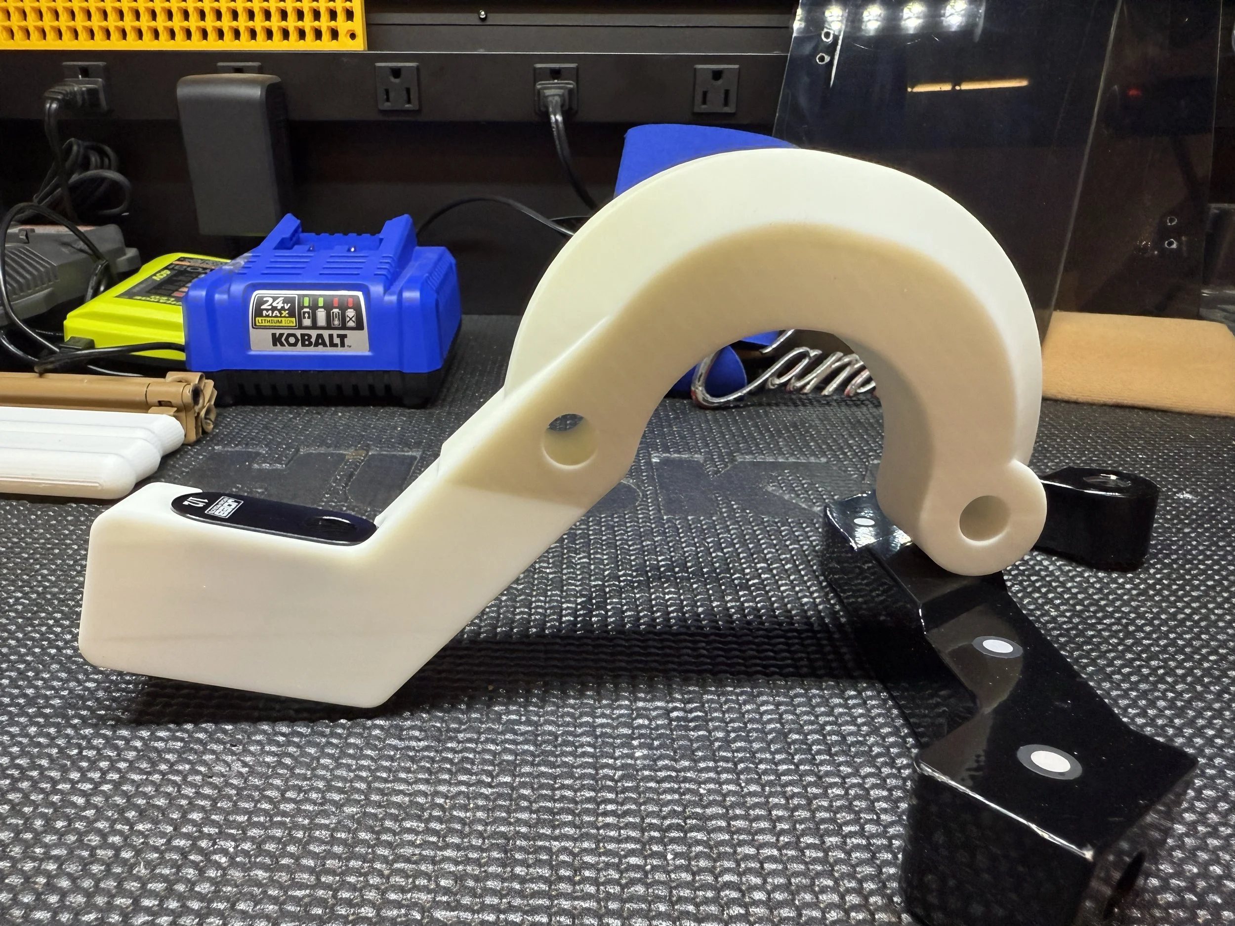 Upgraded V1 Steering Arm Next to Original.JPEG