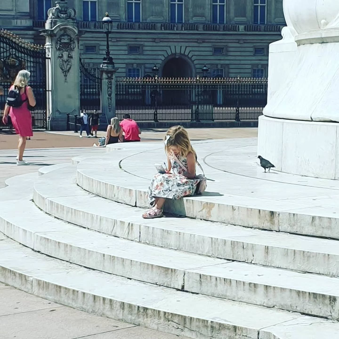 Facebook reminds me of this day out in summer 2020 - that frightening altered reality when London's landmarks were eerily quiet. 
Here, my then nine year old daughter sits down outside Buckingham Palace to write about it in her notebook. 

What do yo