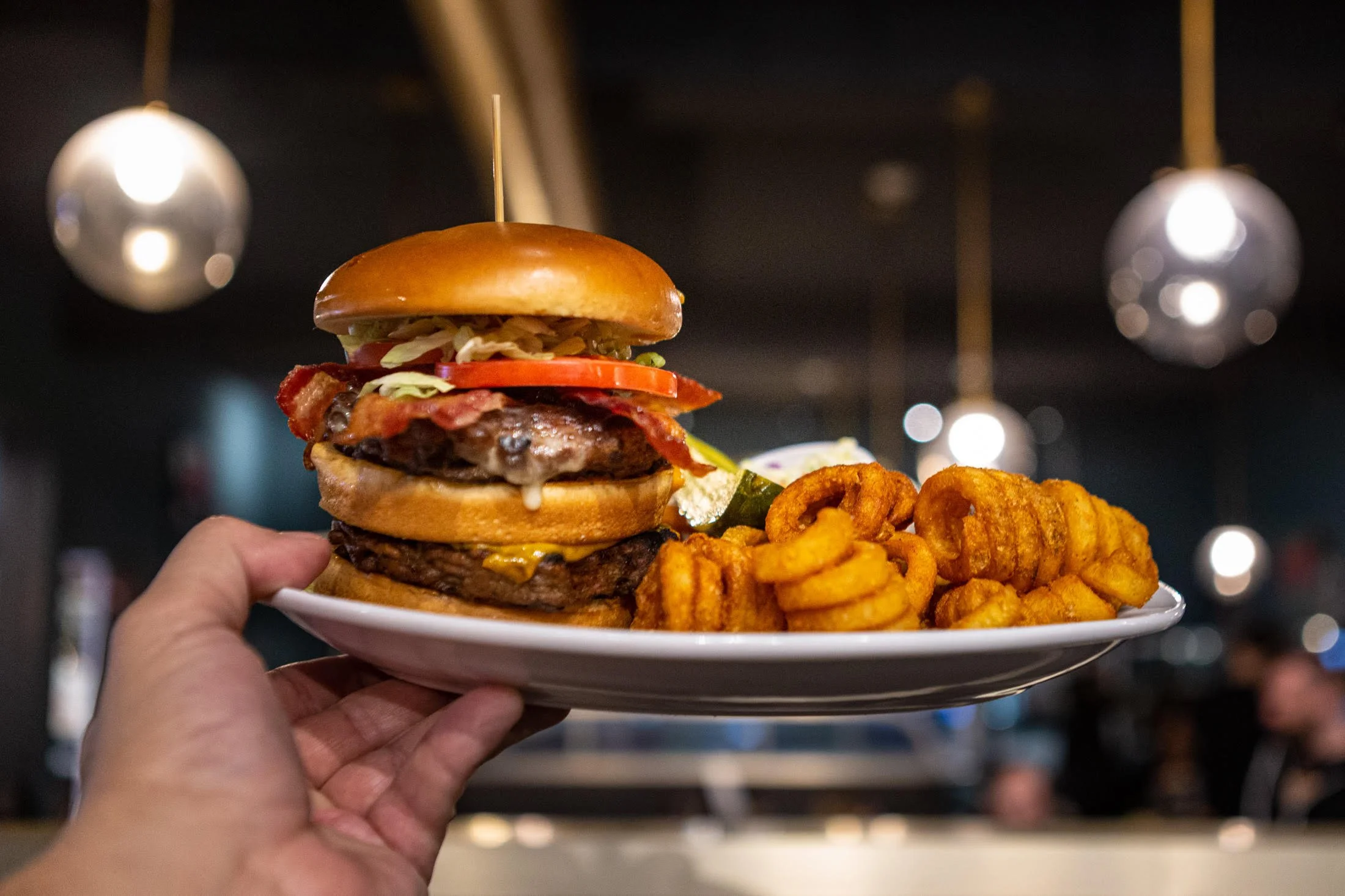 Zak's Burger best burger in town double staqcked, with lettuce, tomato and bacon, side of fries salad or soup