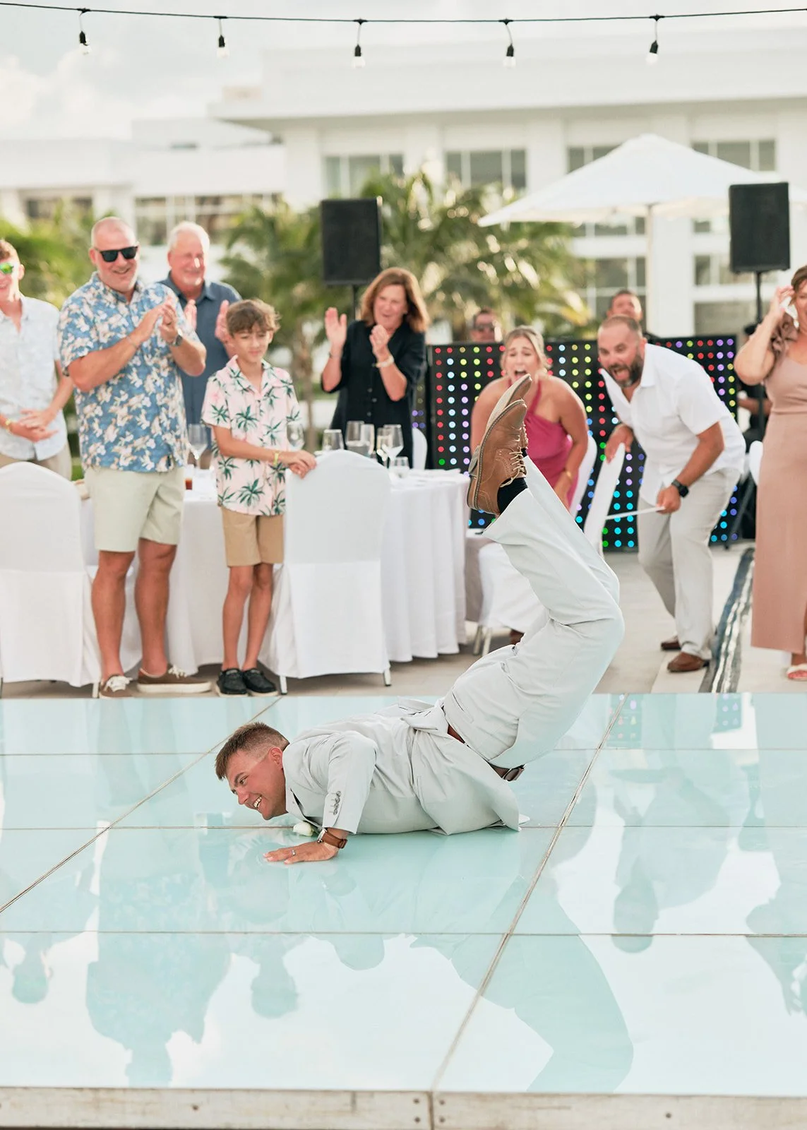 The groom dancing at his destination wedding in Cancun 