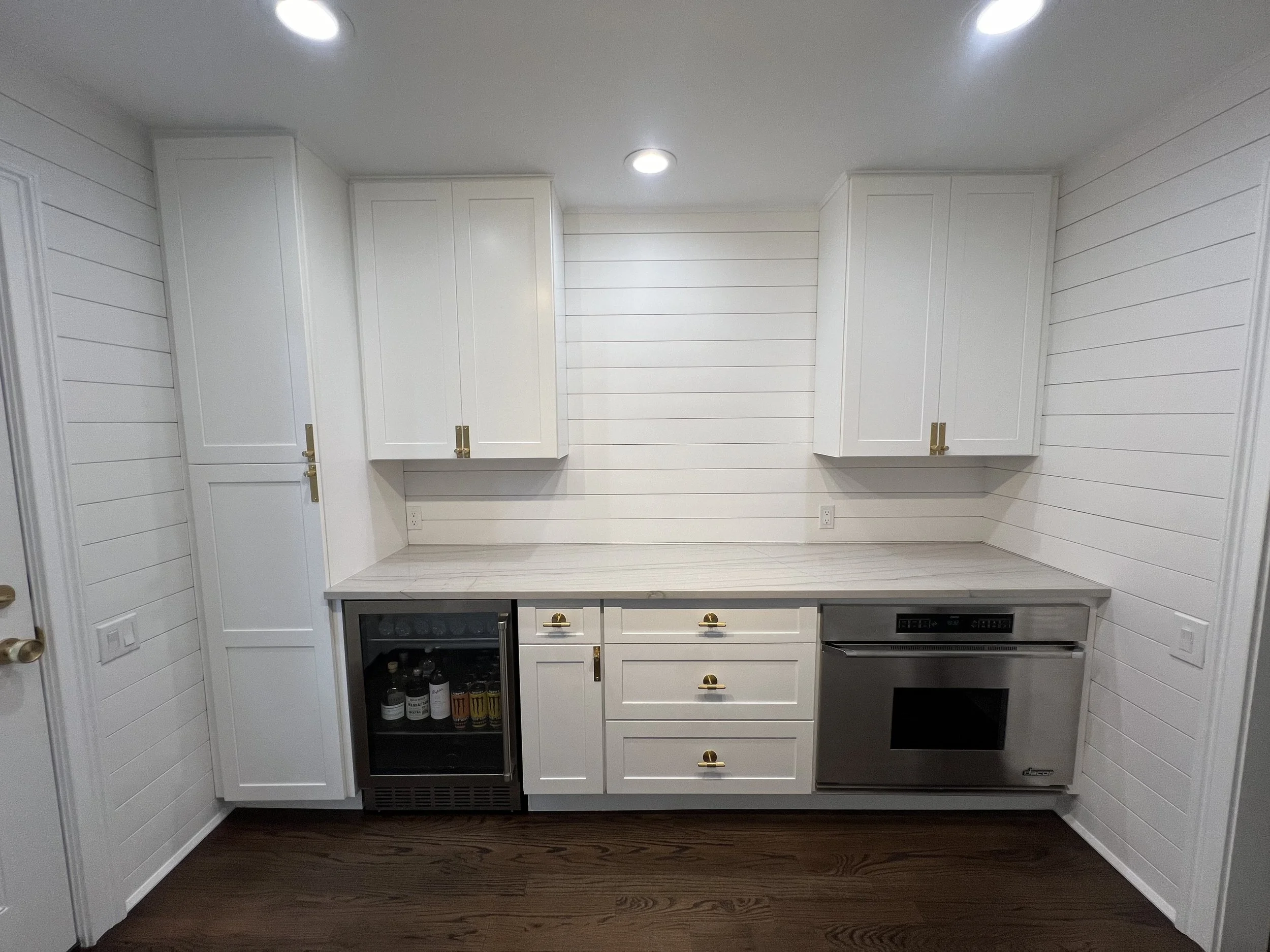 Bright Traditional Cottage Style Kitchen With White Cabinetry, Shiplap Walls, Brass Hardware, And Dark Wood Flooring Kitchen Remodel by Azimuth Home Improvements LLC project photo 2