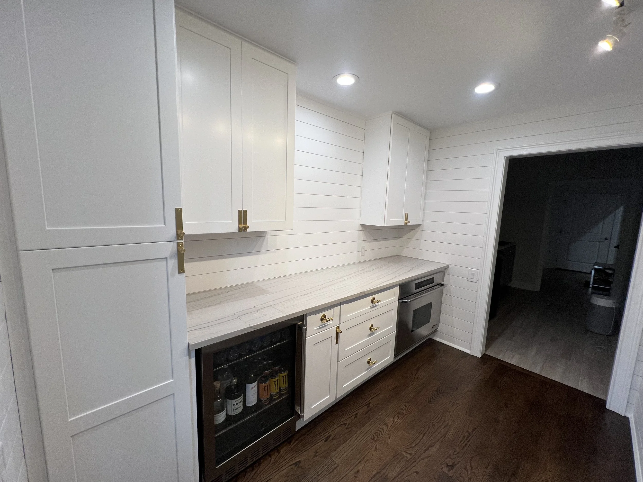Bright Traditional Cottage Style Kitchen With White Cabinetry, Shiplap Walls, Brass Hardware, And Dark Wood Flooring Kitchen Remodel by Azimuth Home Improvements LLC project photo 4