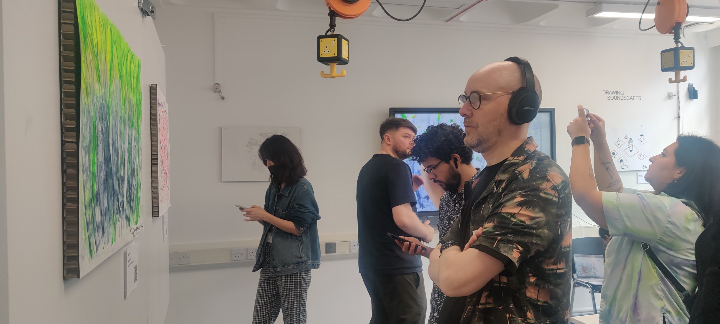 Fig. 21,22: People attending the exhibition while listening to the soundscapes