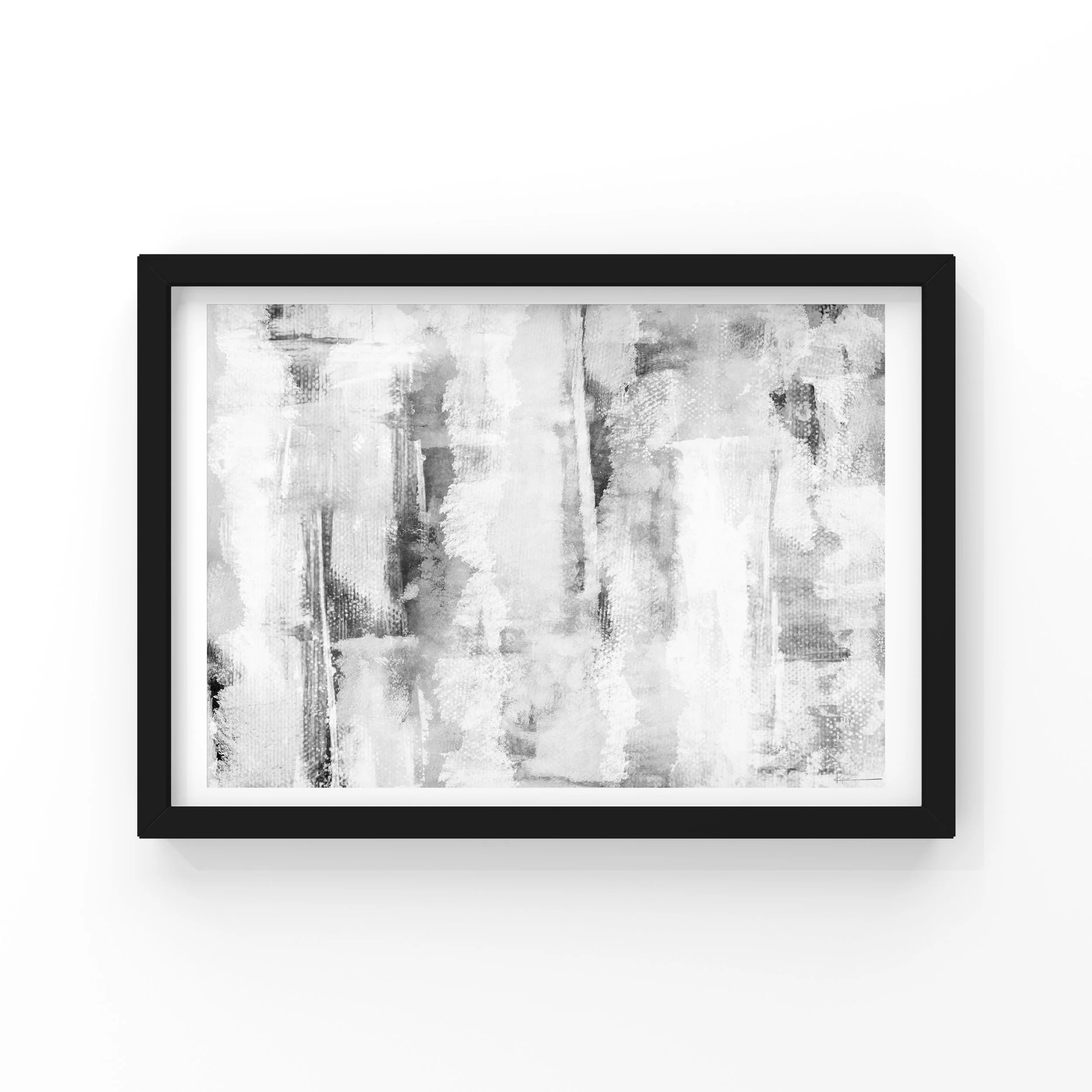 A framed abstract black and white painting hanging on a white wall.