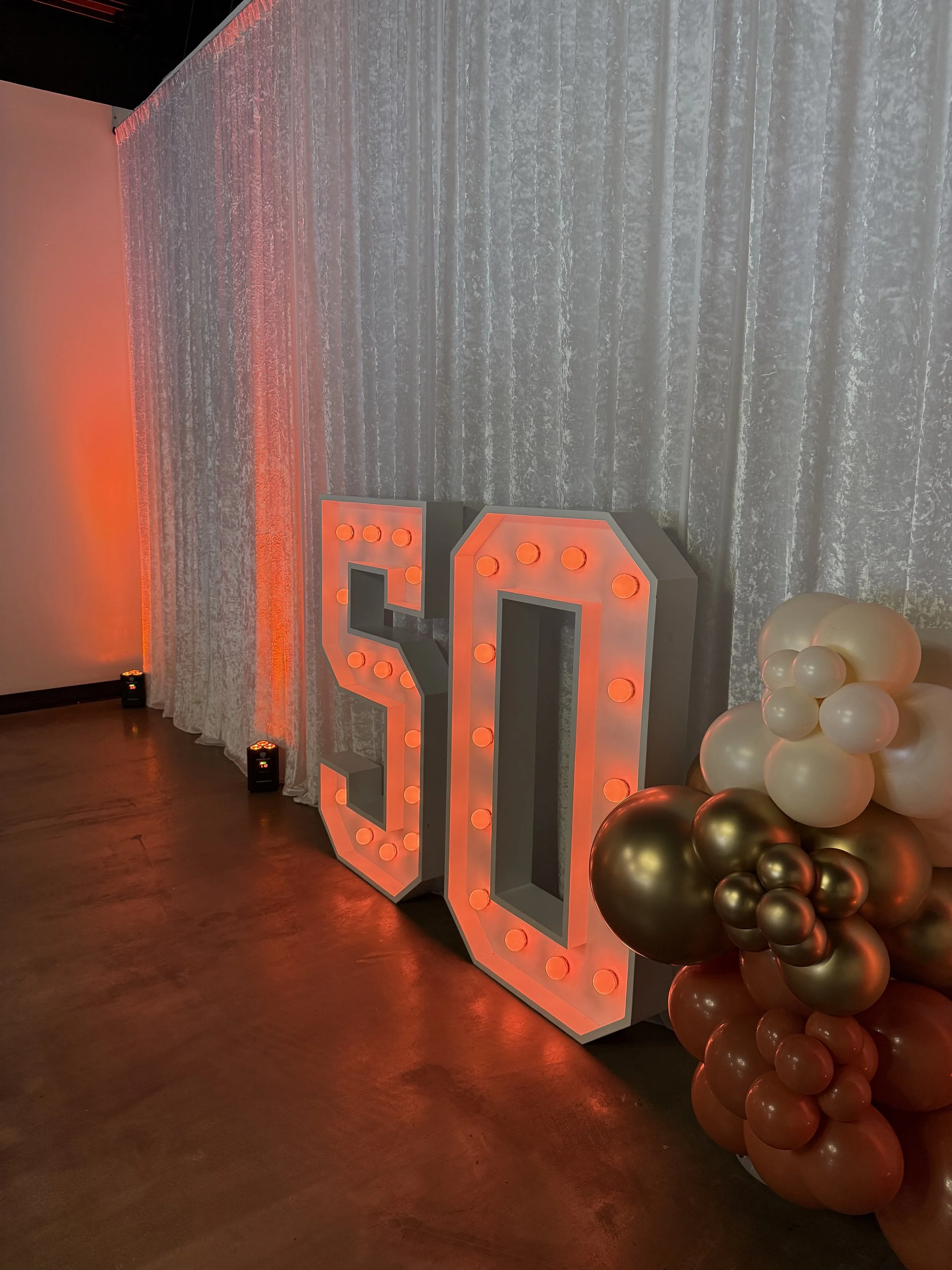 Elegant 50 marquee numbers for birthday setup at Bee Real Event Space in Portsmouth, VA. Fits up to 65 guest with custom decor options. 