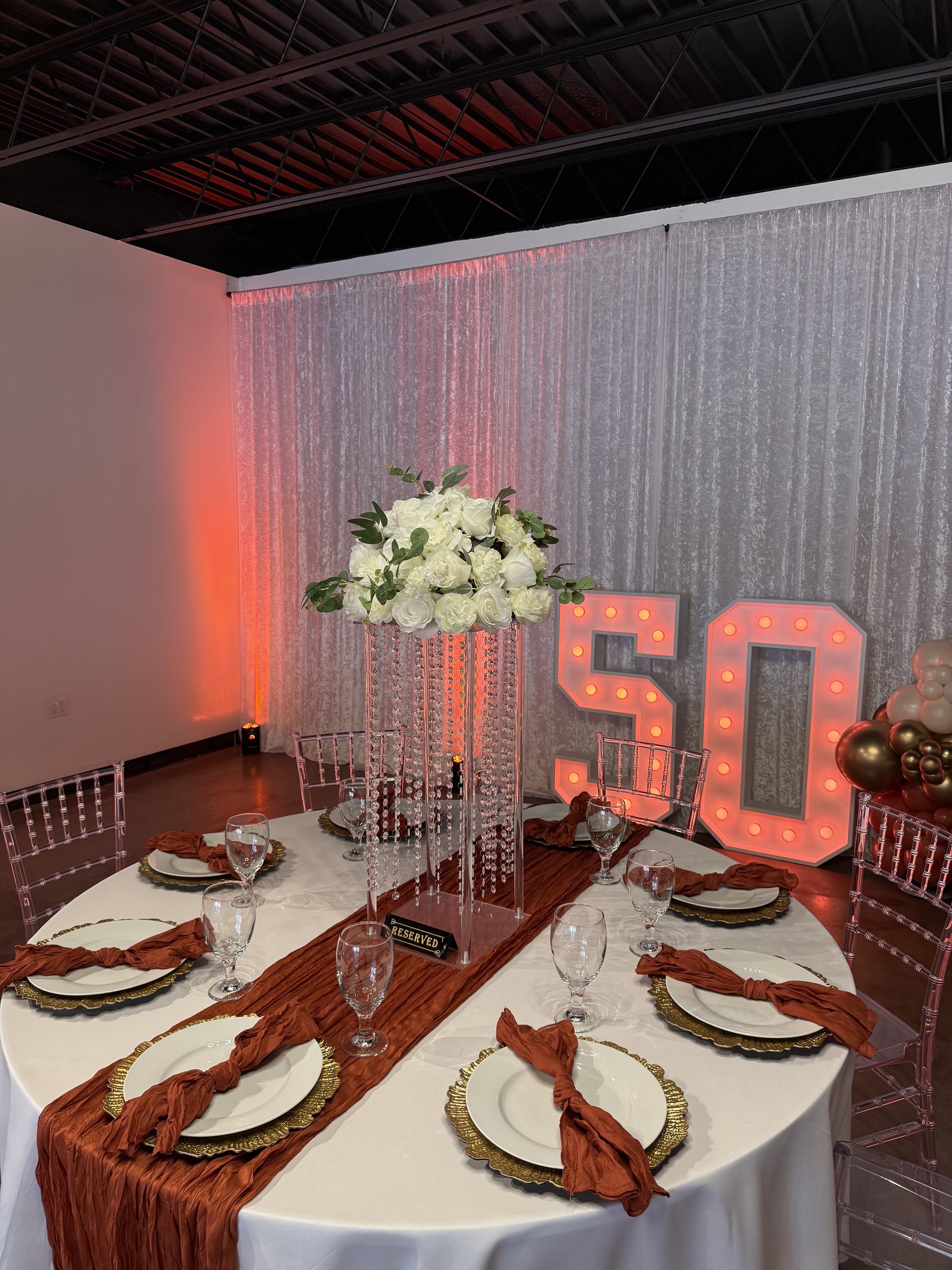 Elegant birthday table setup at Bee Real Event Space in Portsmouth, VA. Fits up to 65 guest with custom decor options. 