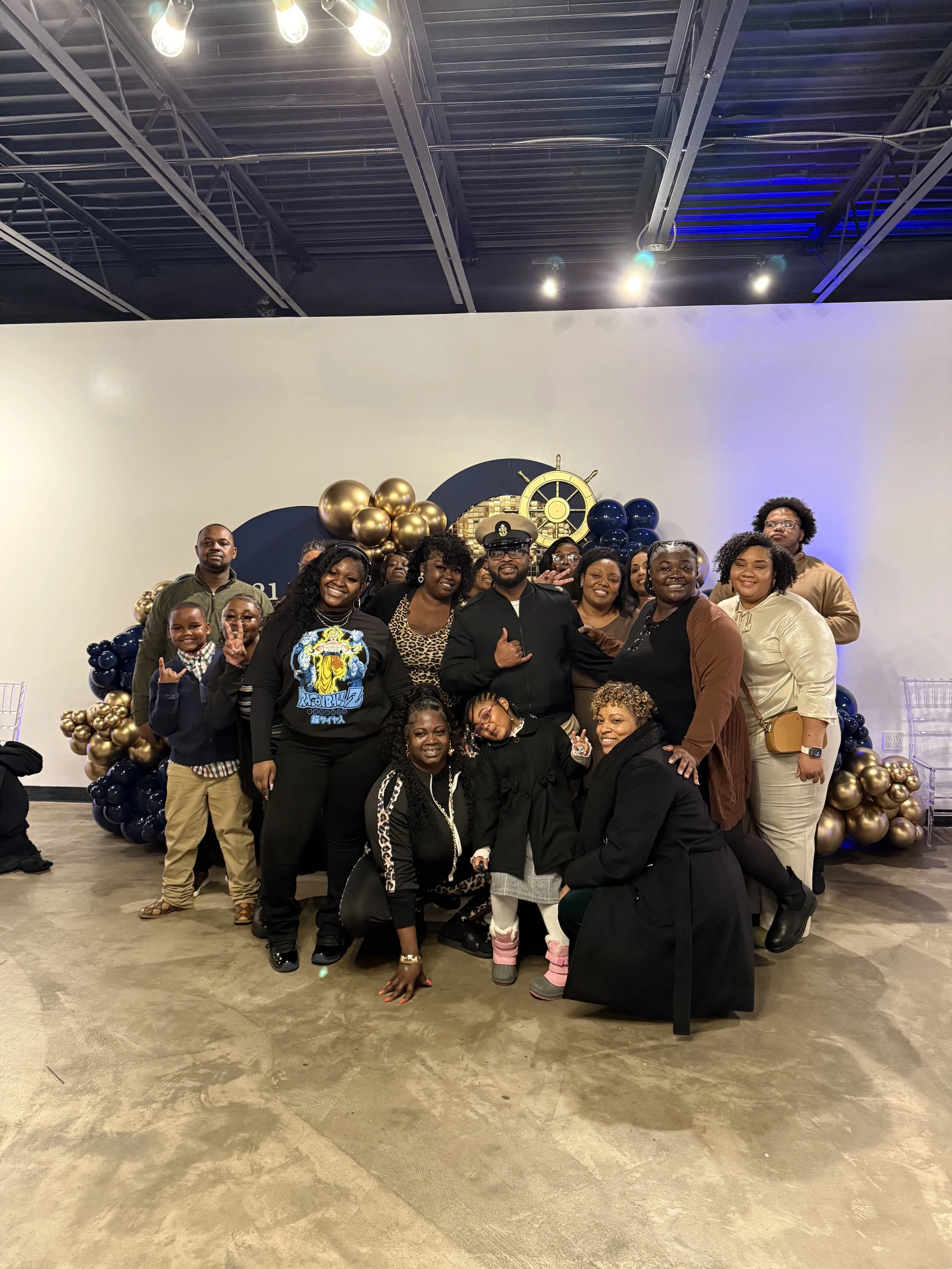 Family photo during a U.S. Navy Retirement celebration at Bee Real Event Space located in Portsmouth, VA. 