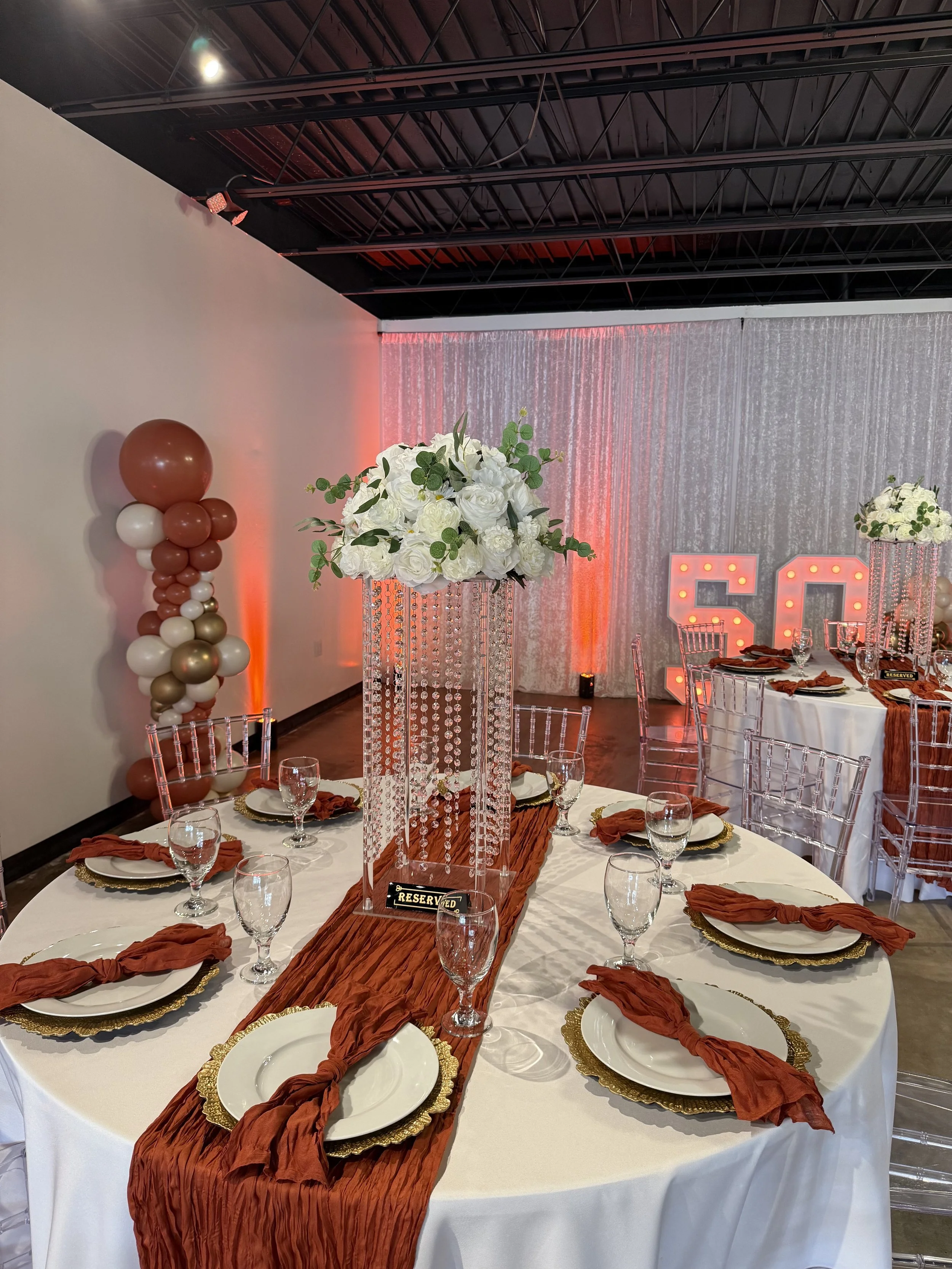 Elegant birthday table setup at Bee Real Event Space in Portsmouth, VA. Fits up to 65 guest with custom decor options. 