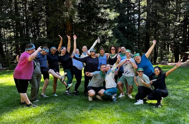 Friend group celebrating together outdoors at a private event