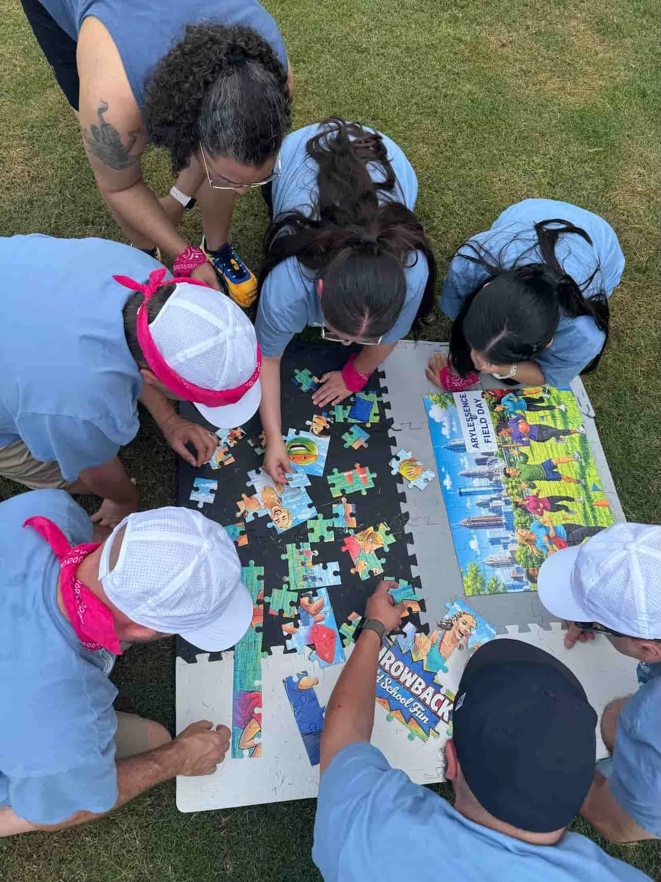 Guests assembling a custom Throwback puzzle during a private event game