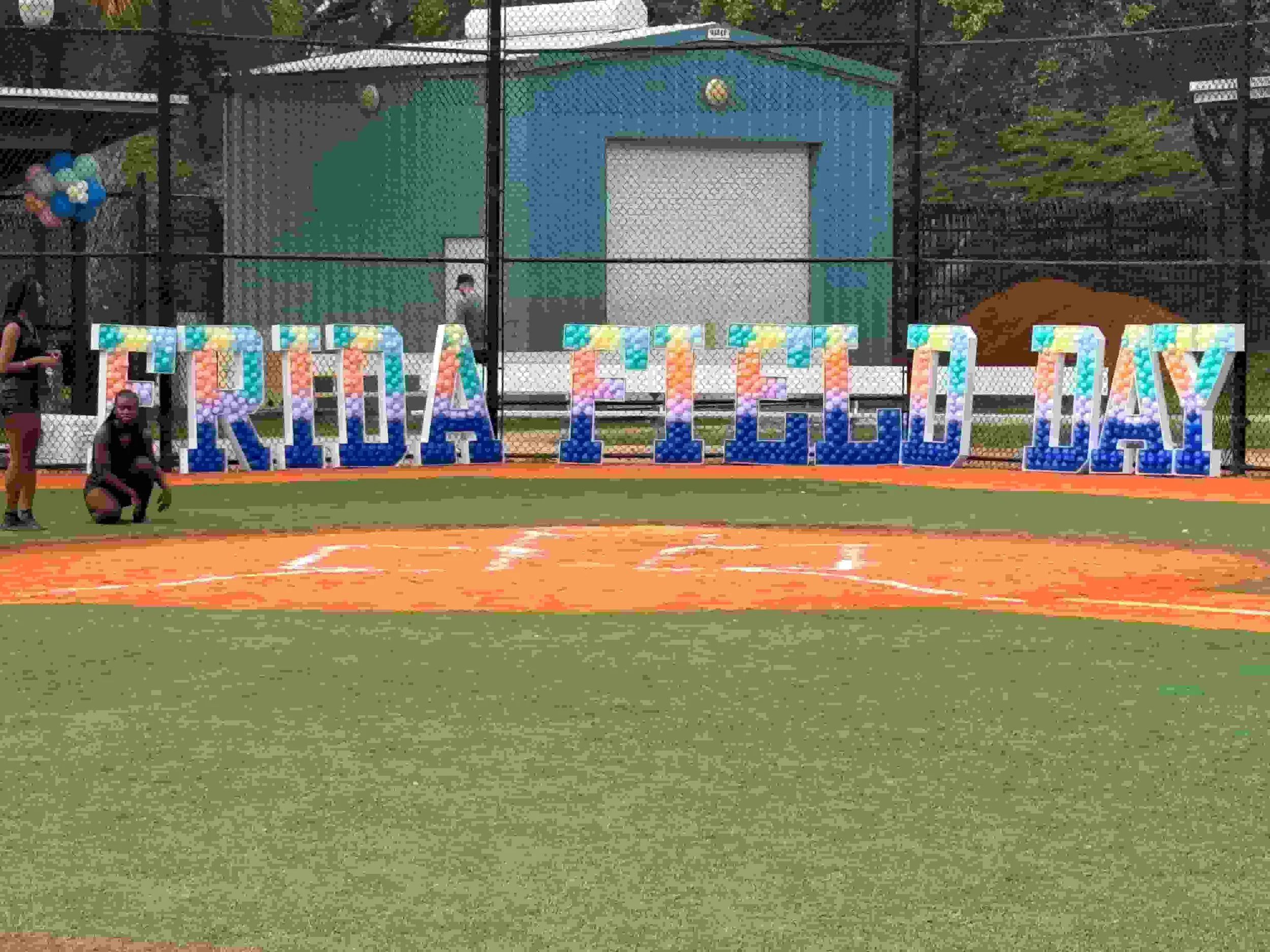 Colorful balloon letter sign spelling out Field Day at a corporate event venue in Miami