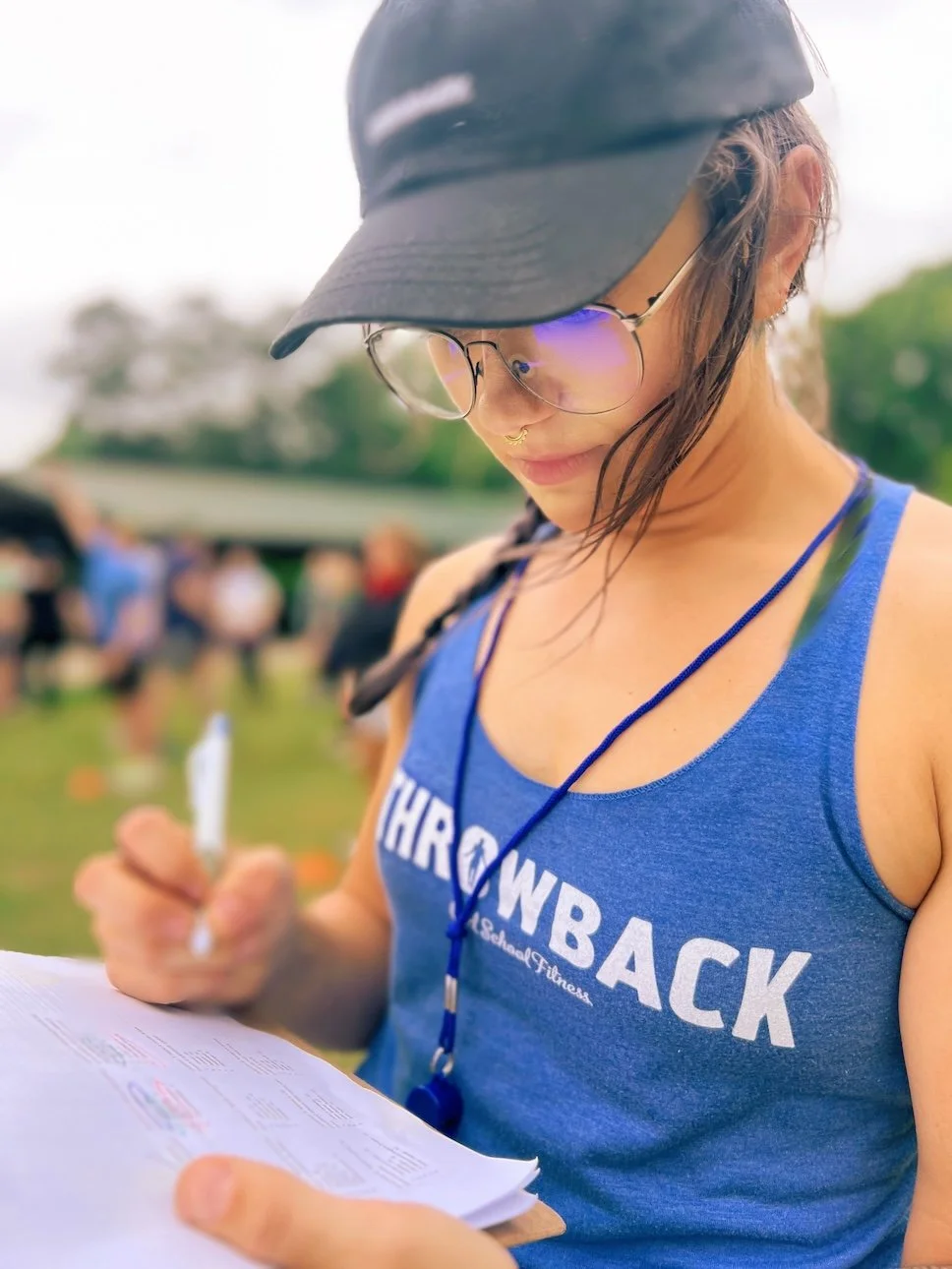 Throwback coach tallying scores at the end of a team building event