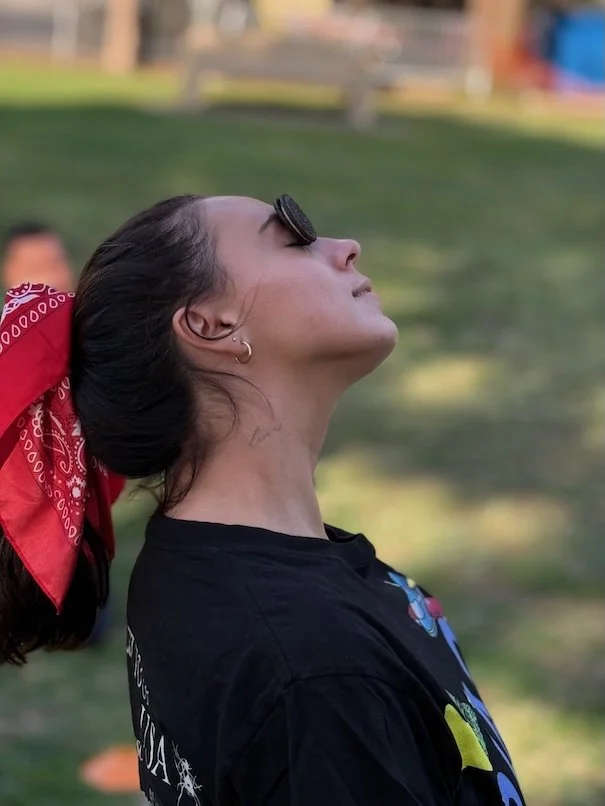 An adult party guest plays the ‘Face the Cookie’ challenge, a fast-paced game inspired by Minute to Win It that’s perfect for birthdays and field day events