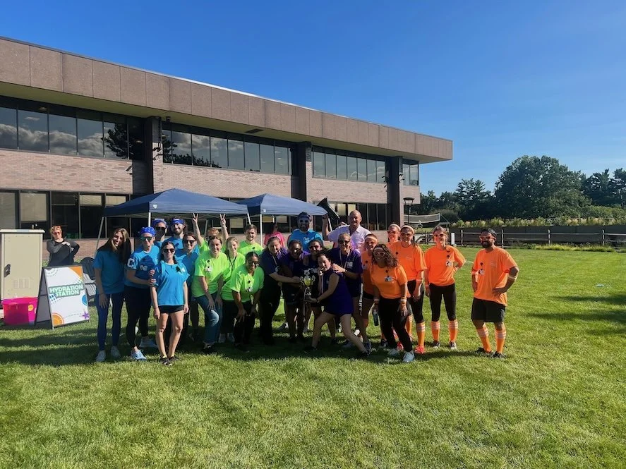 Coworkers celebrating together after a team building activity