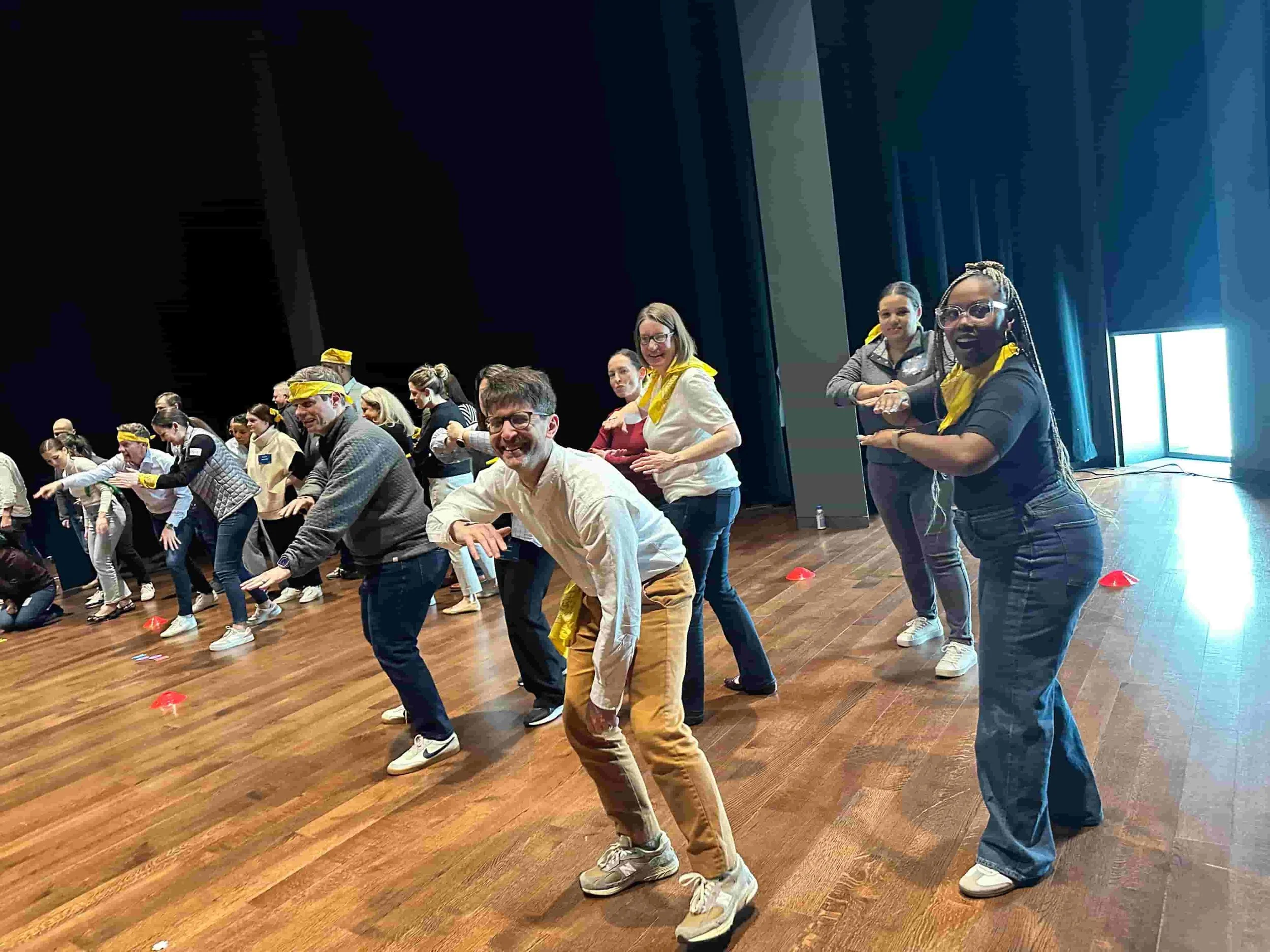 Large group celebrating together during an indoor party game
