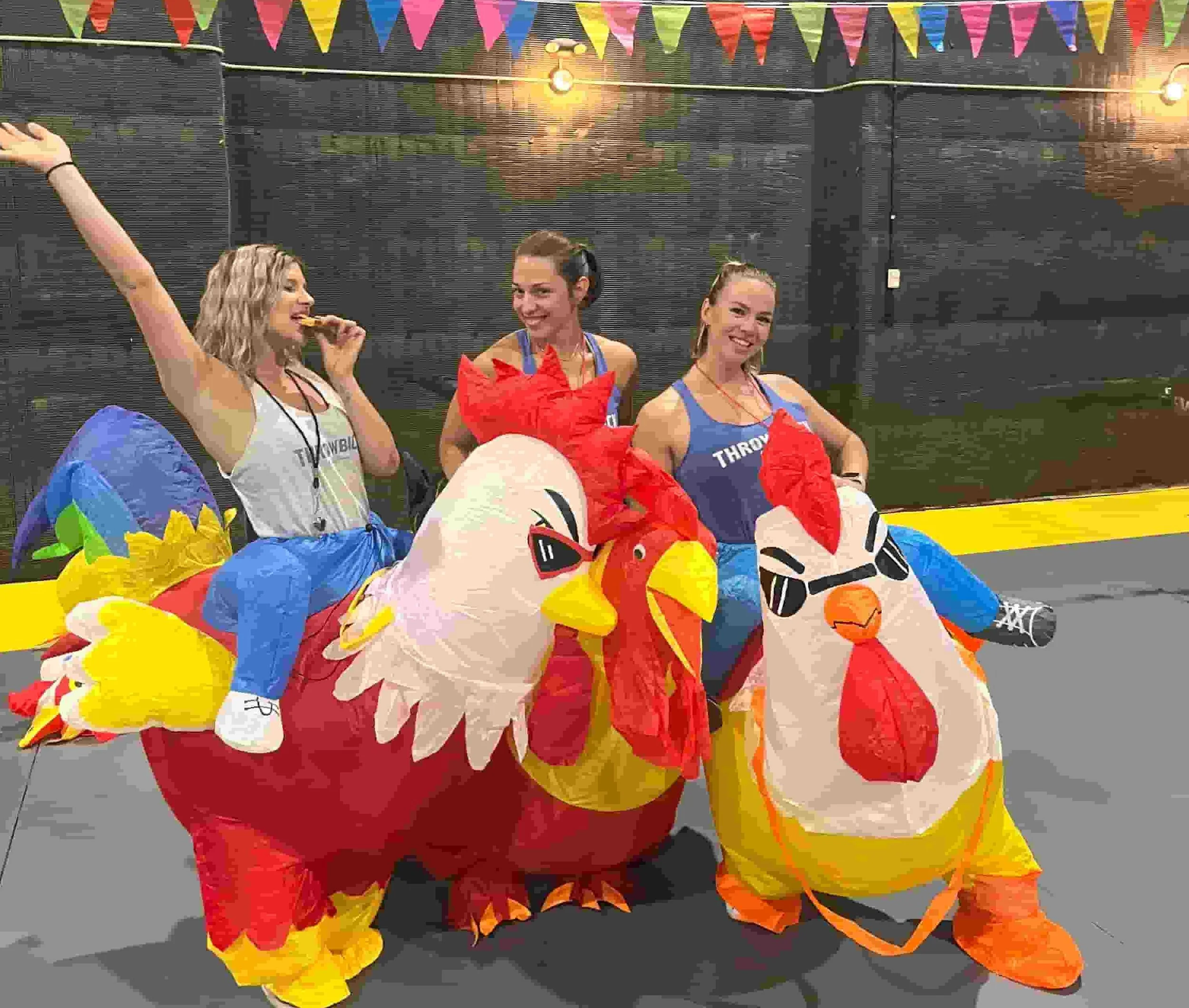 Throwback staff in inflatable chicken suits during the egg and spoon race at a corporate team building event in Los Angeles